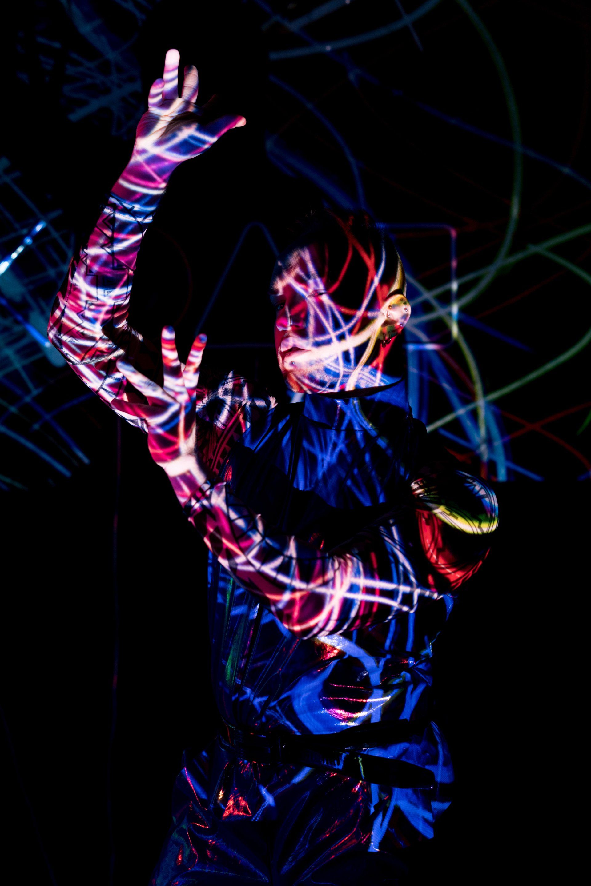 A person with glow in the dark paint on their body