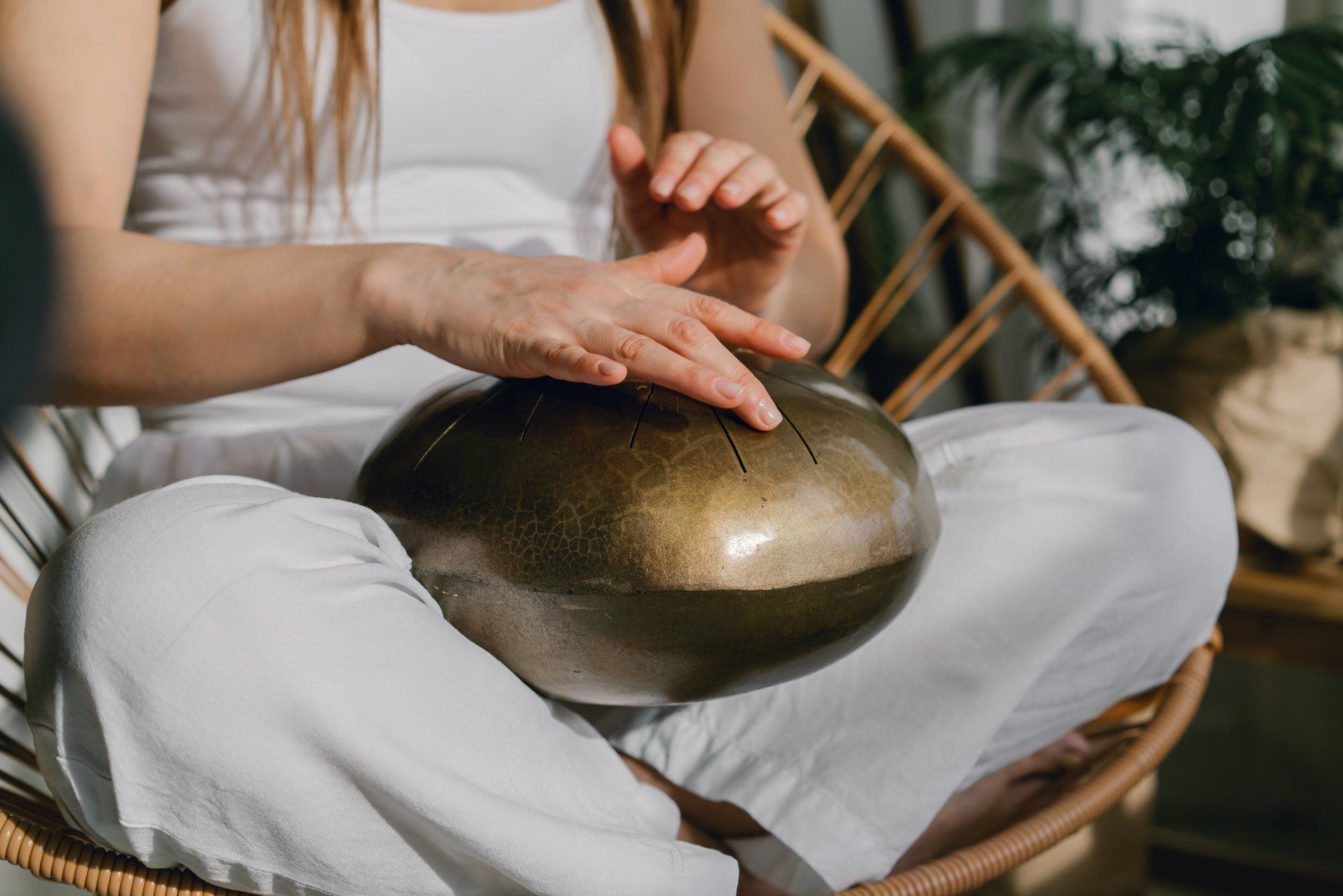 woman with singing bowl in lap