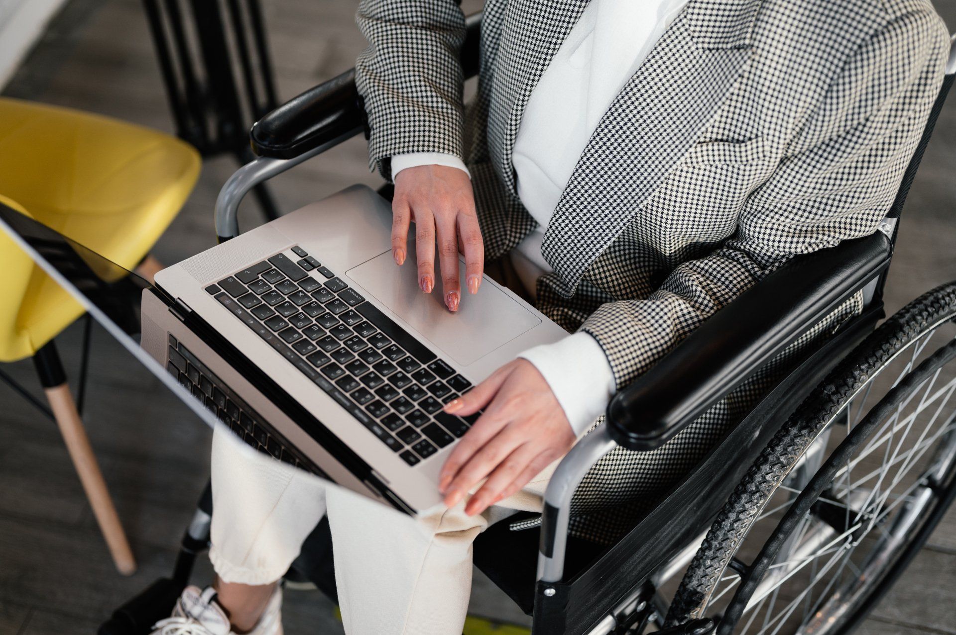 Wheelchair user with a laptop