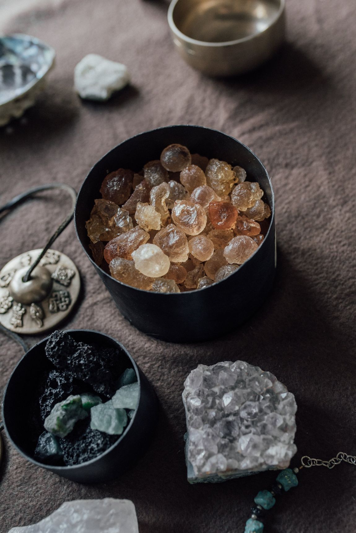 There are many different types of crystals on the table.