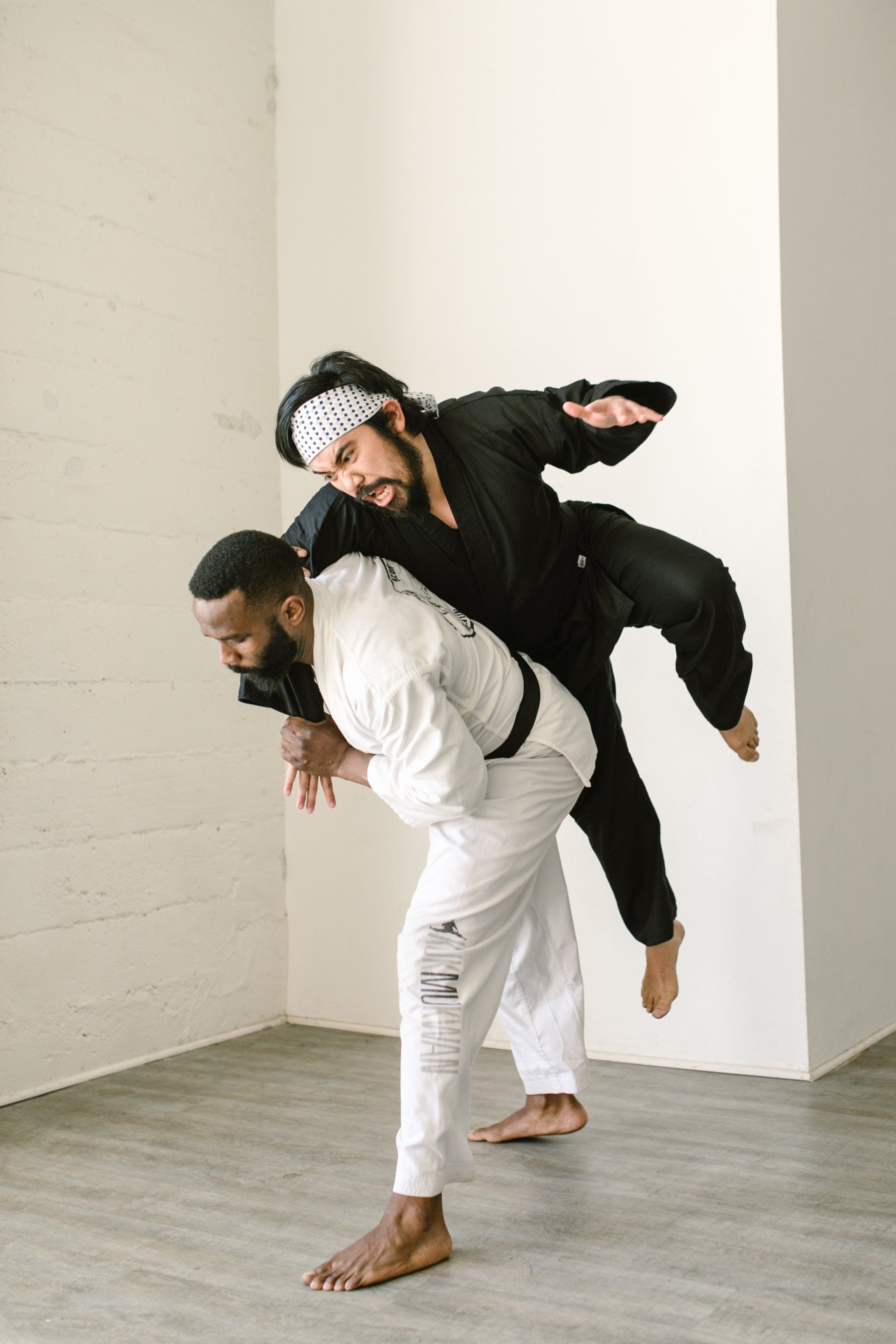 Two martial artists practicing judo