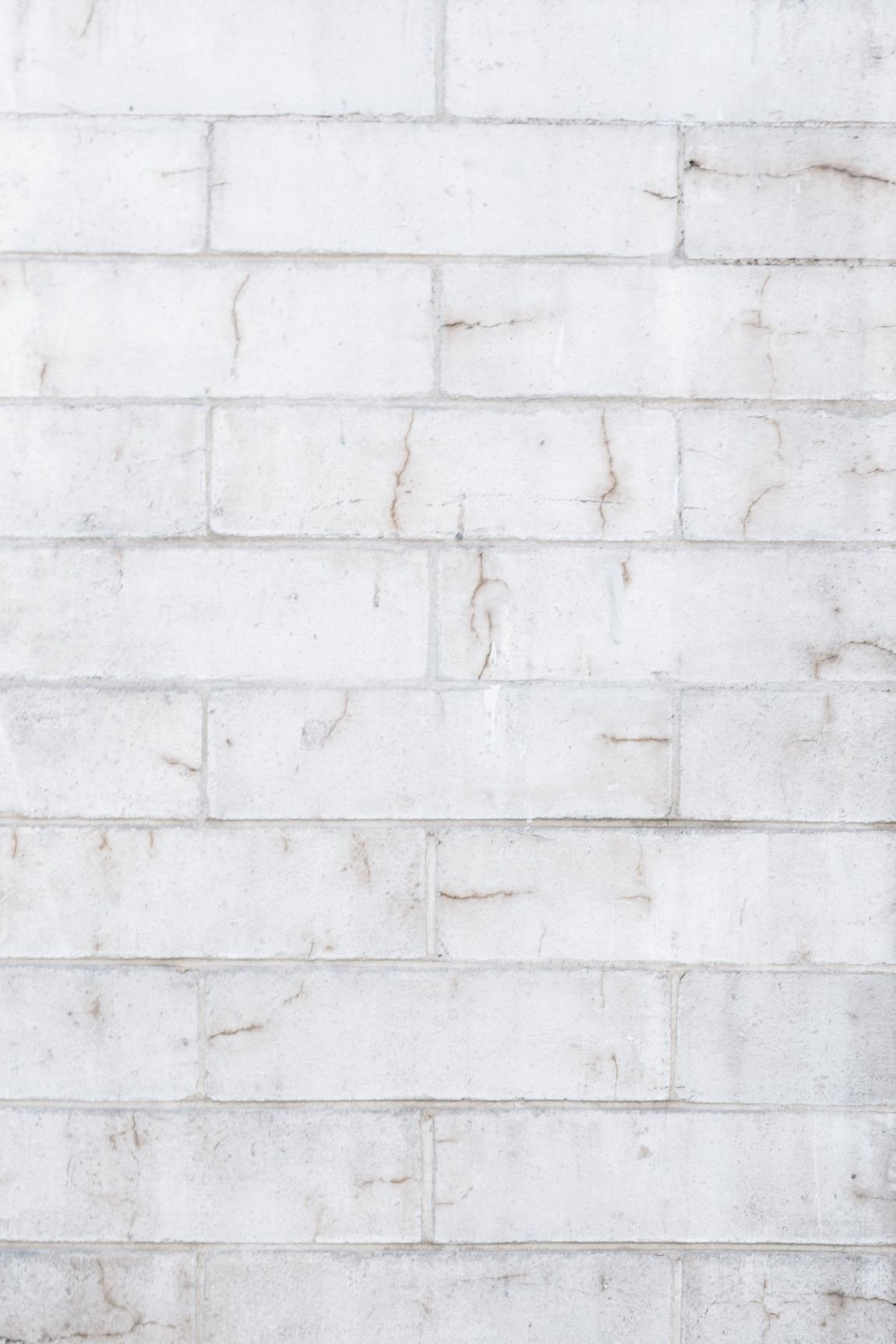 A close up of a white brick wall.