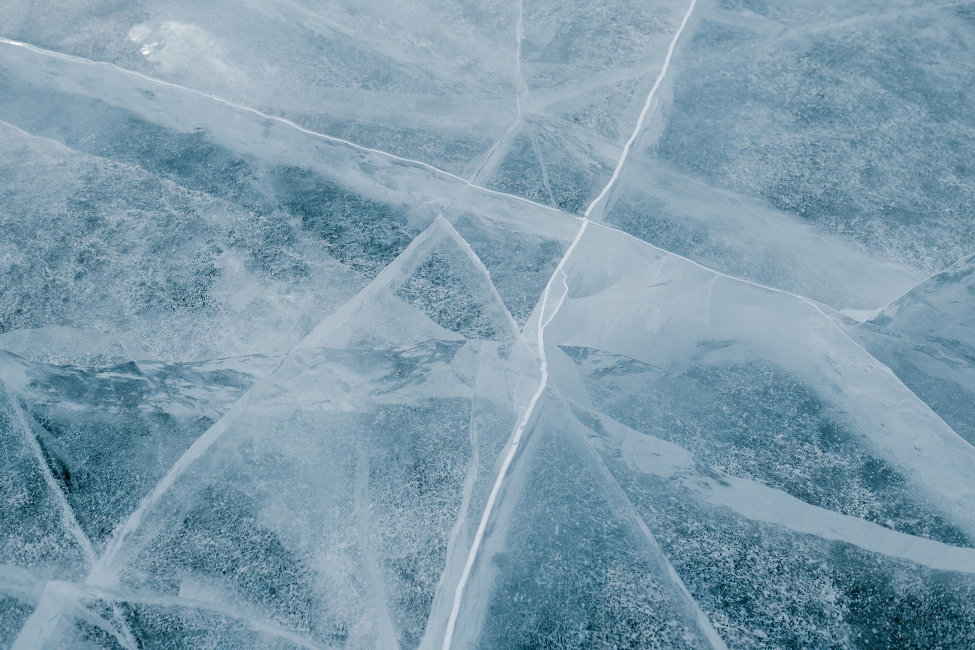 A close up of a cracked piece of ice.