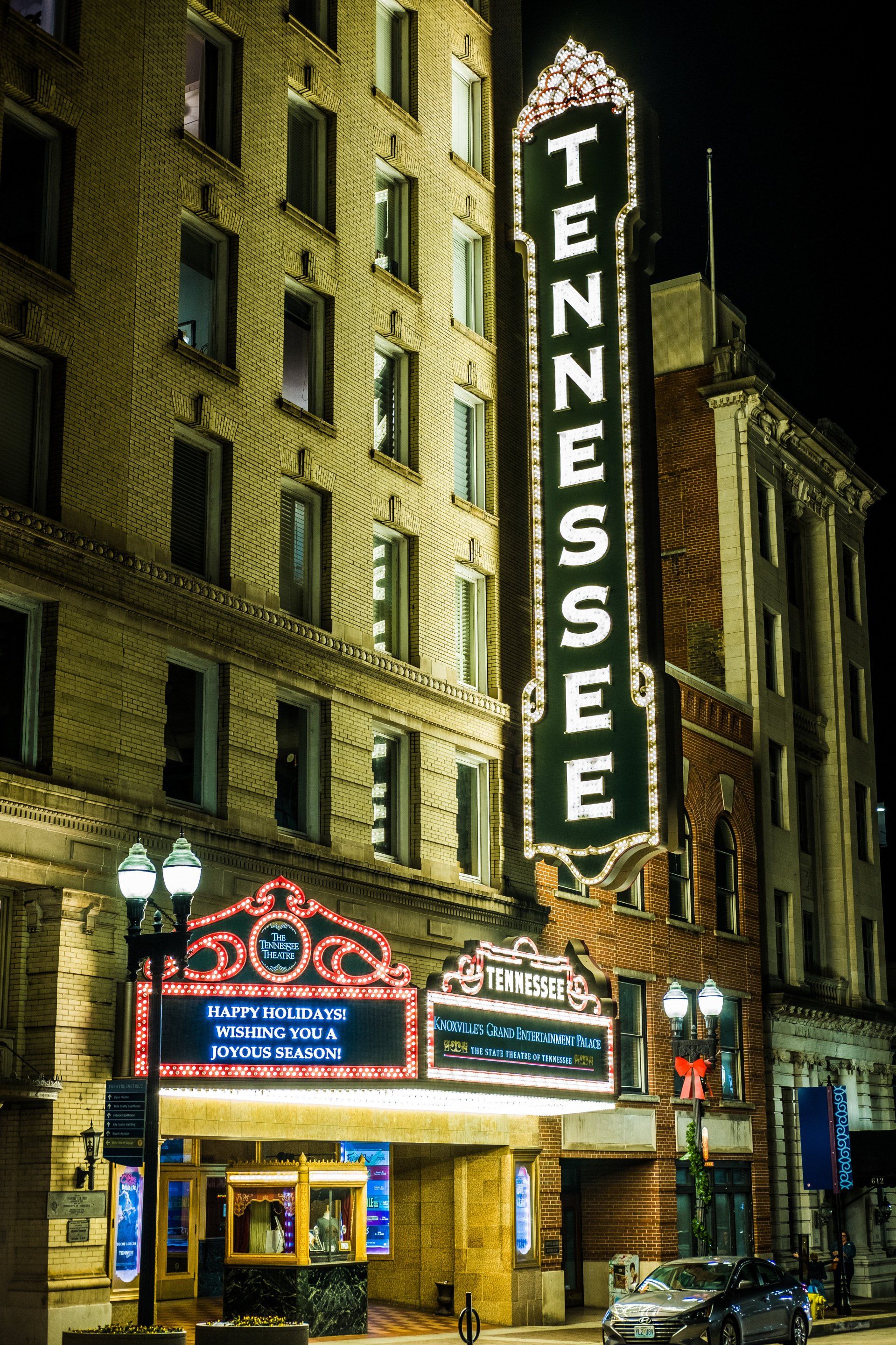 The tennessee theater is lit up at night