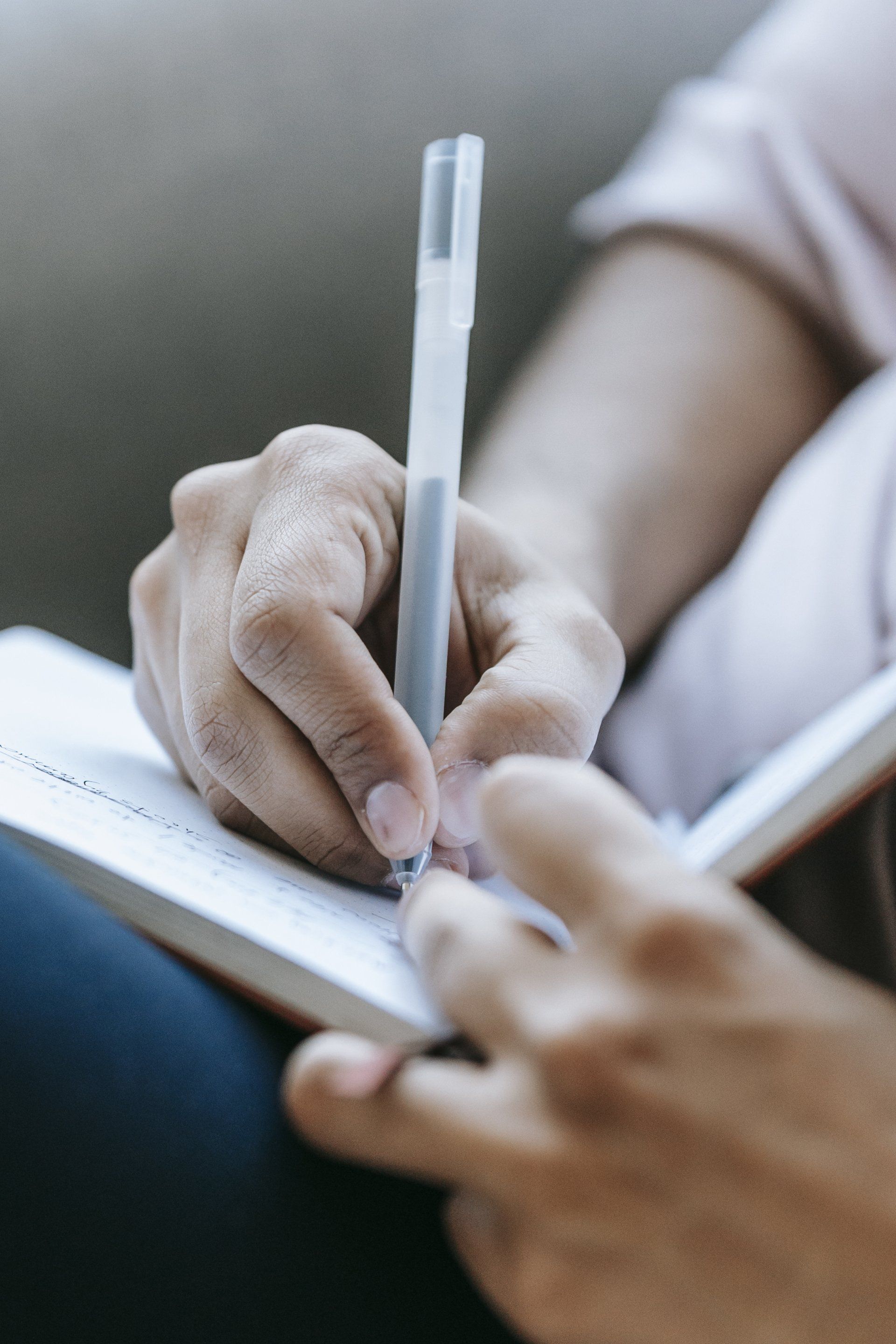 student taking notes during supervision