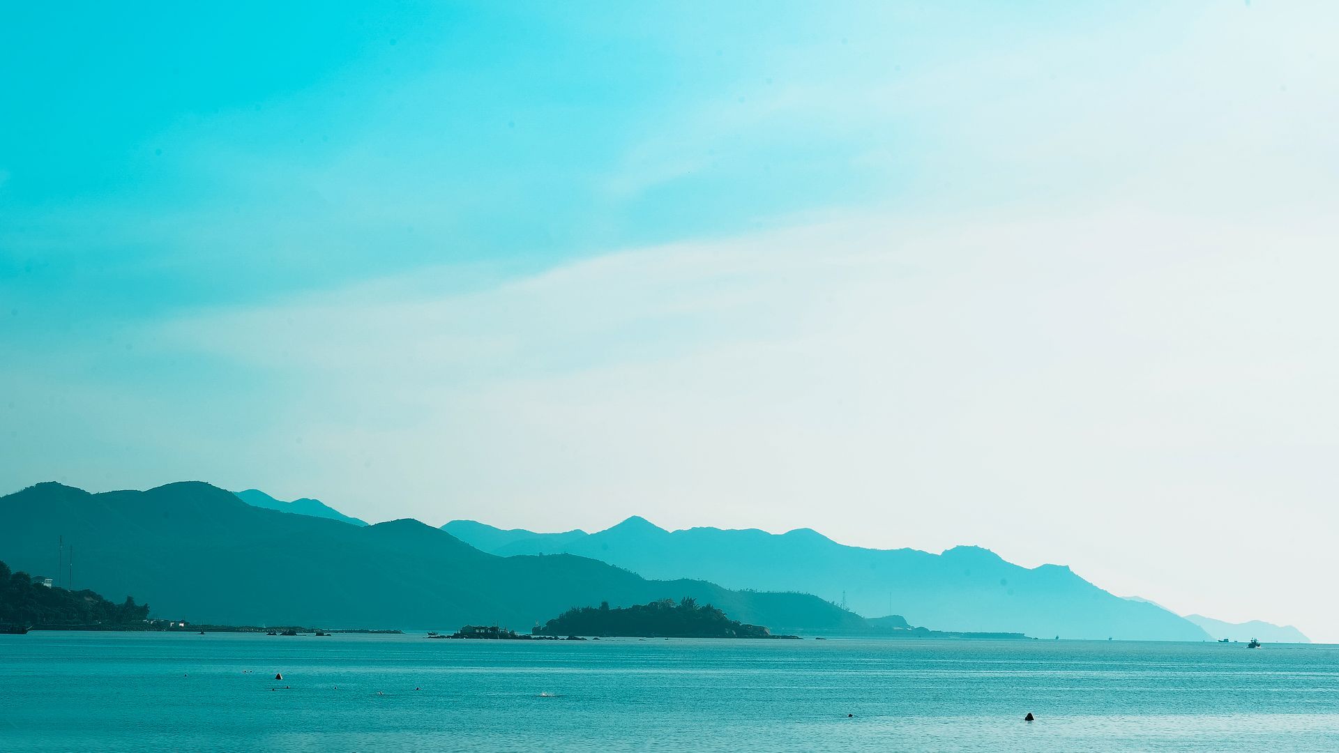 A large body of water with mountains in the background.