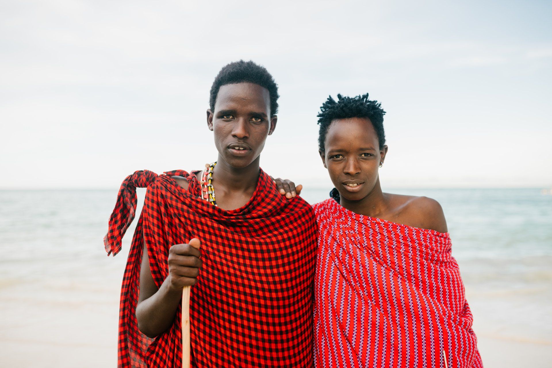 native young men wearing red cloths