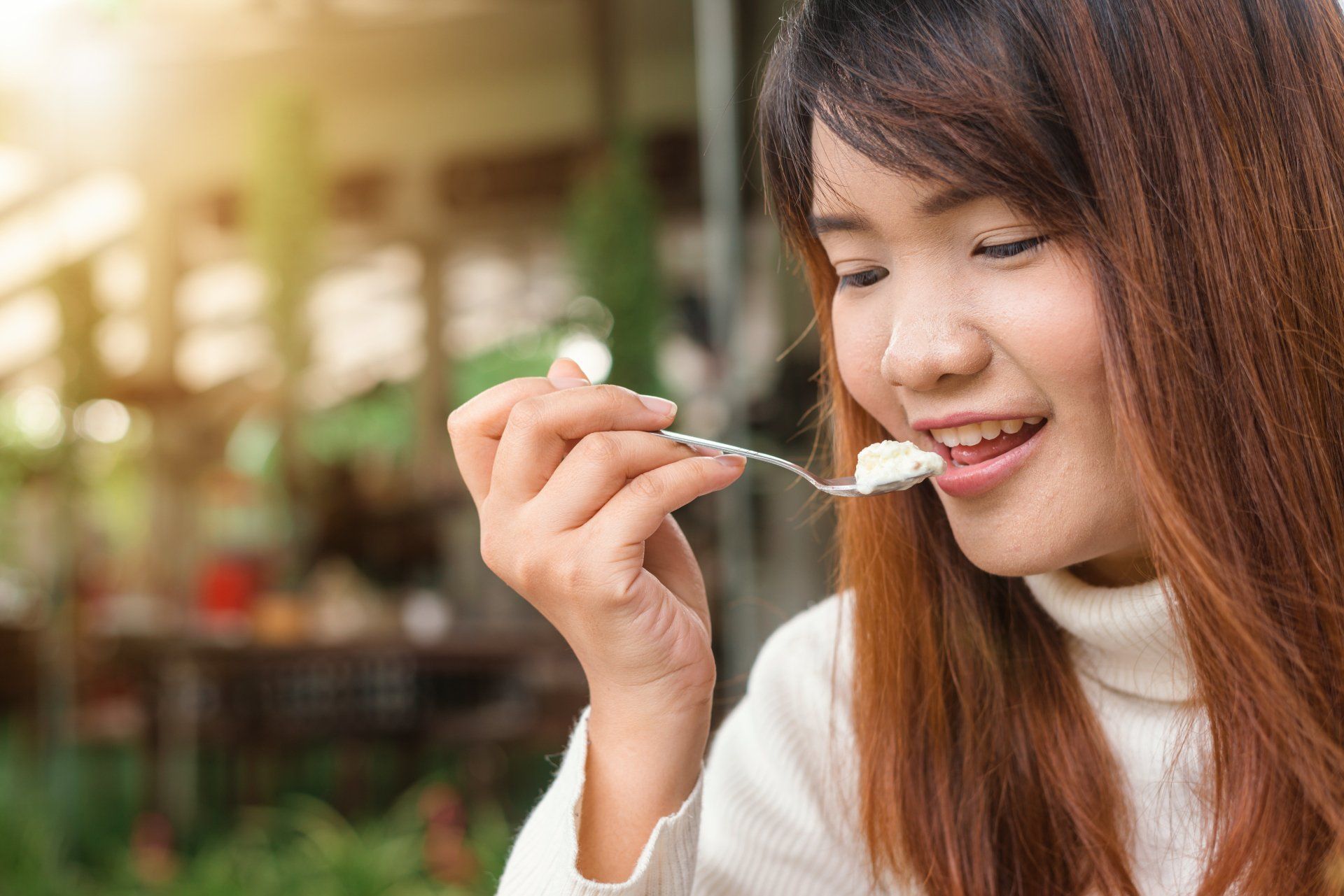 Image of a young woman eating.