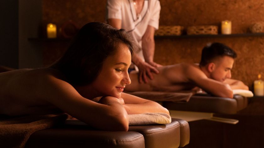 A couple getting a massage at the same time in a spa