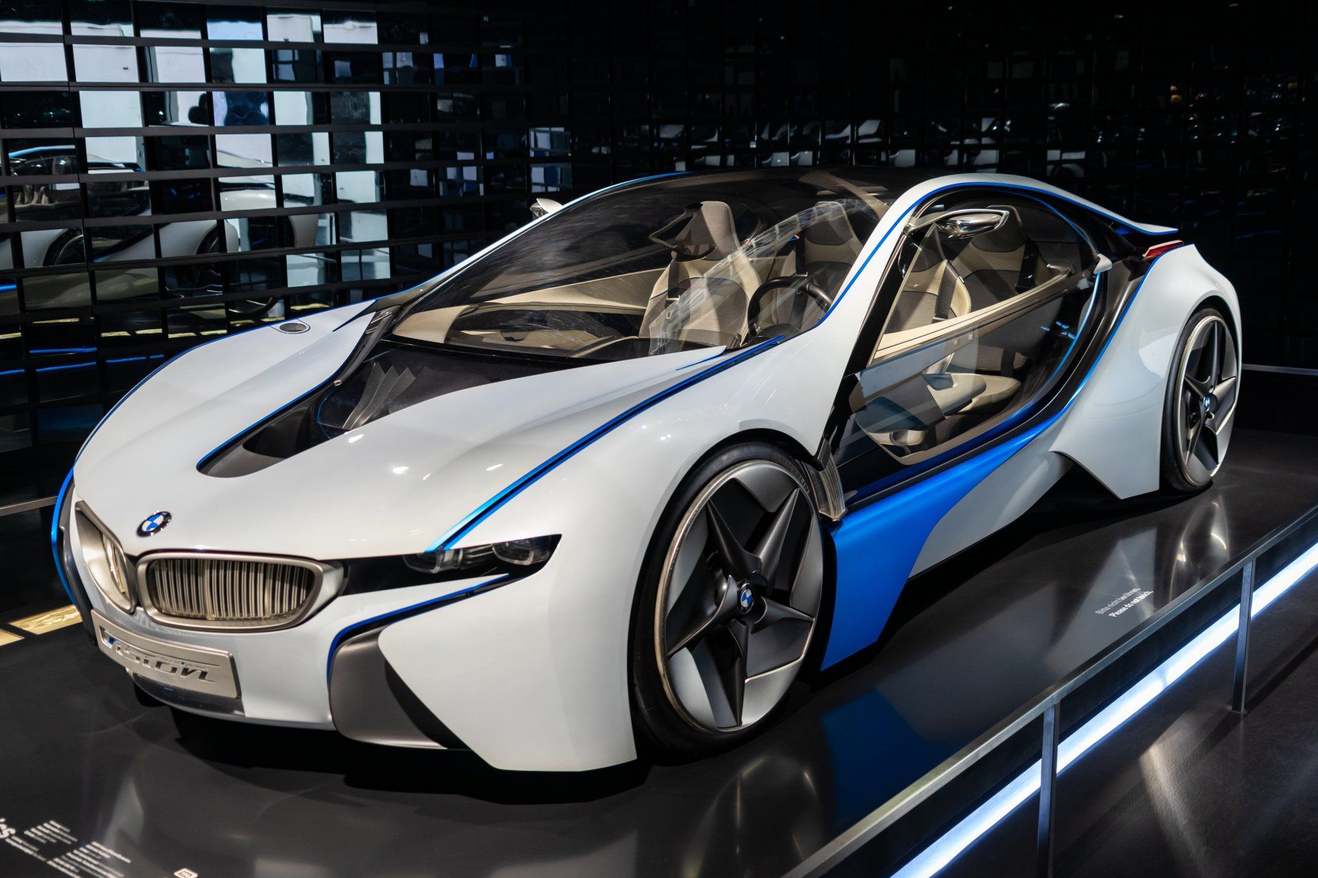 A white and blue bmw i8 concept car is on display