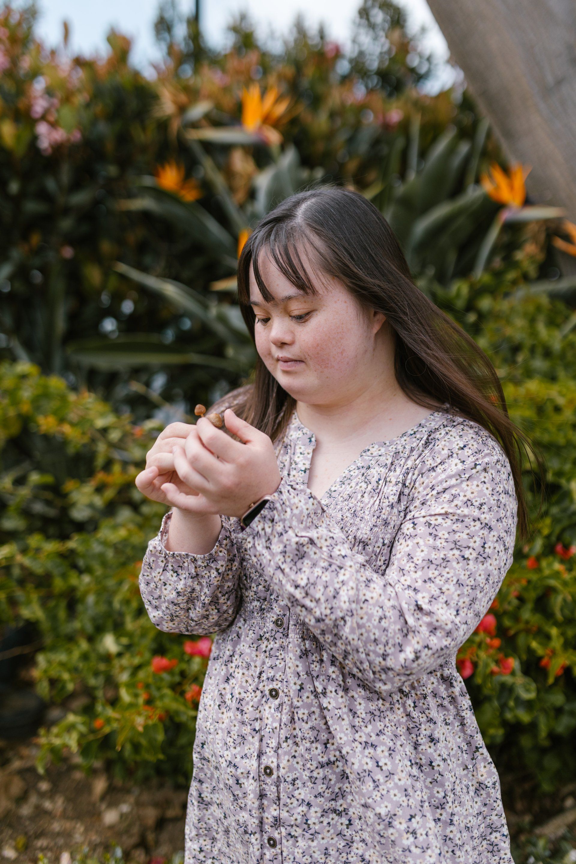 Services gallery; image of a girl holding a flower