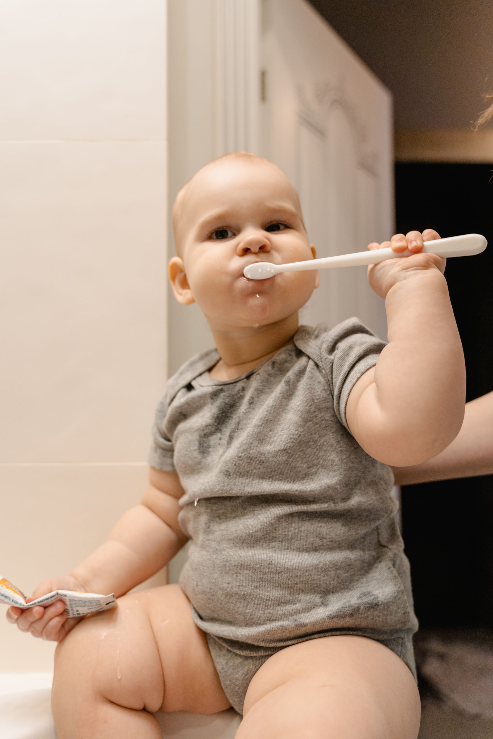 9 month old learning to brush his teeth.