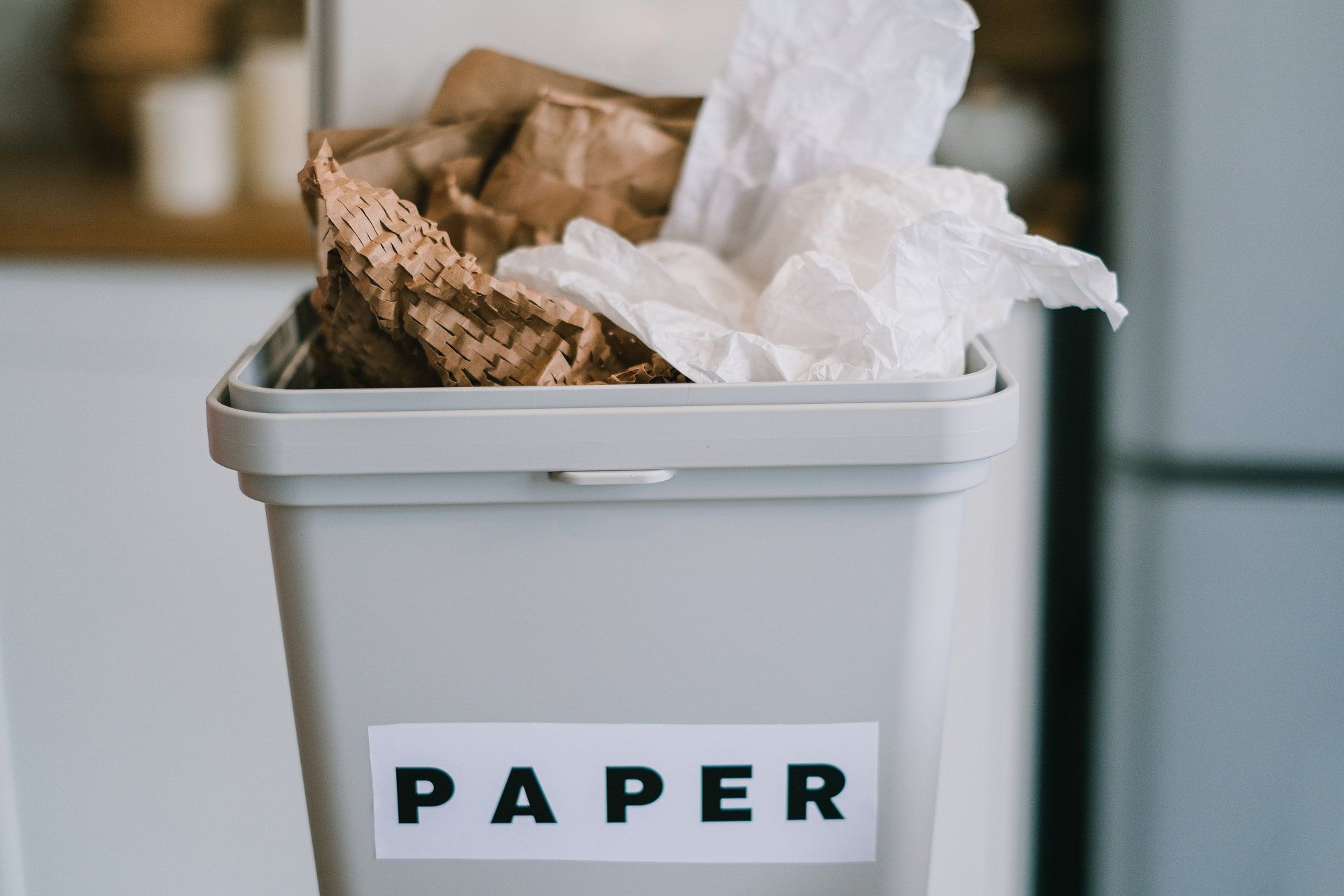 papers on a trash can