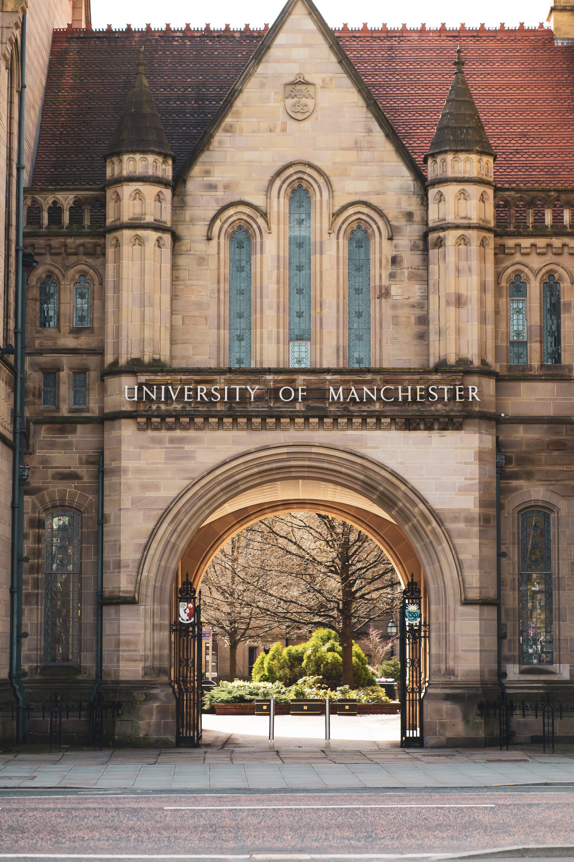 A large stone building with a large archway leading to it.