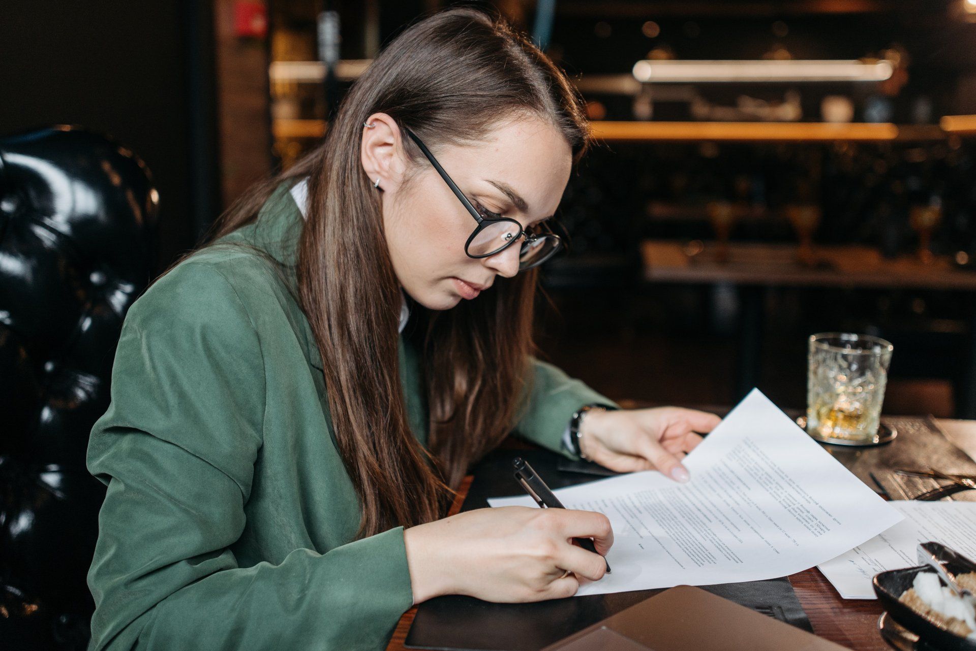 Woman signing divorce papers