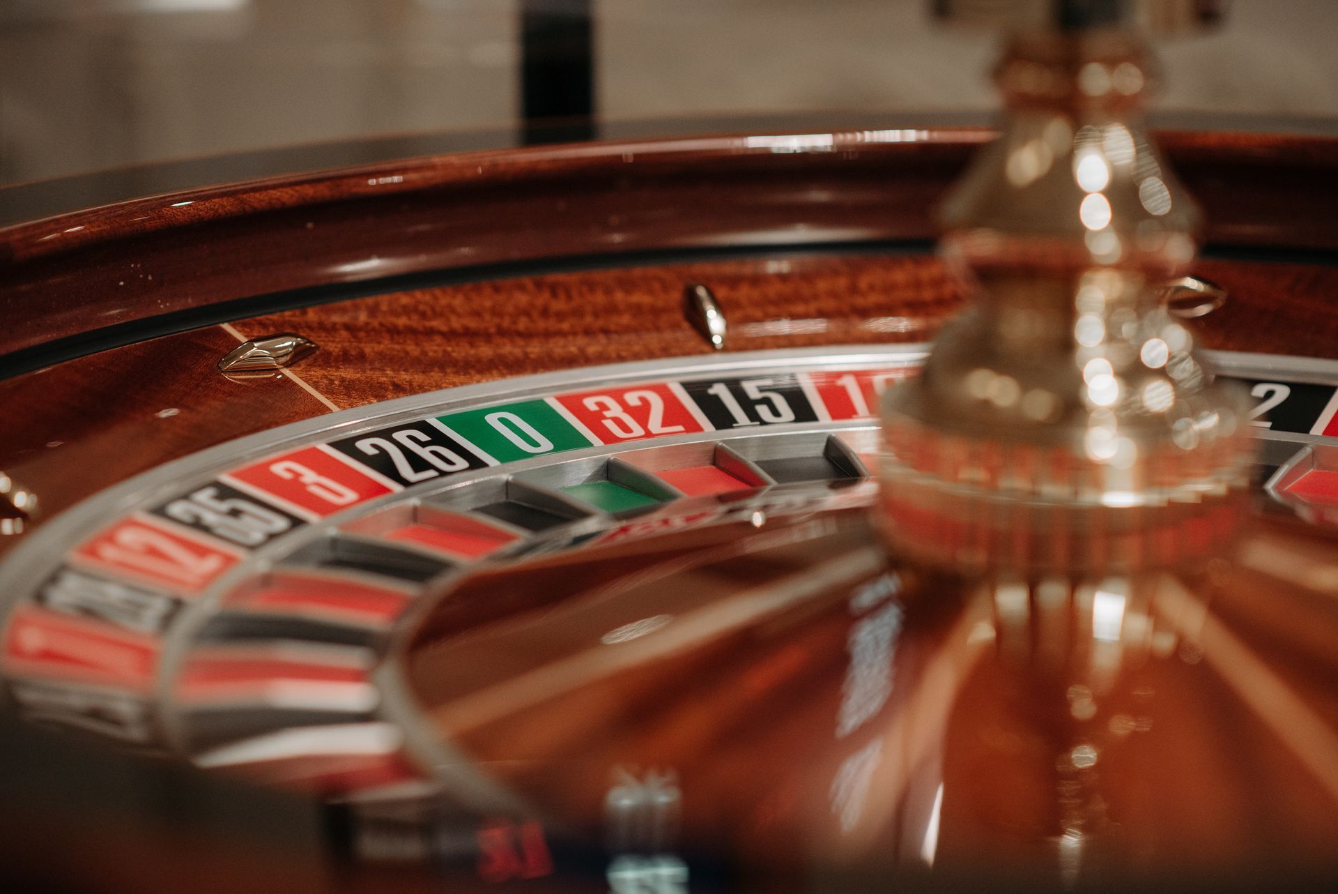 A close up of a roulette wheel in a casino.