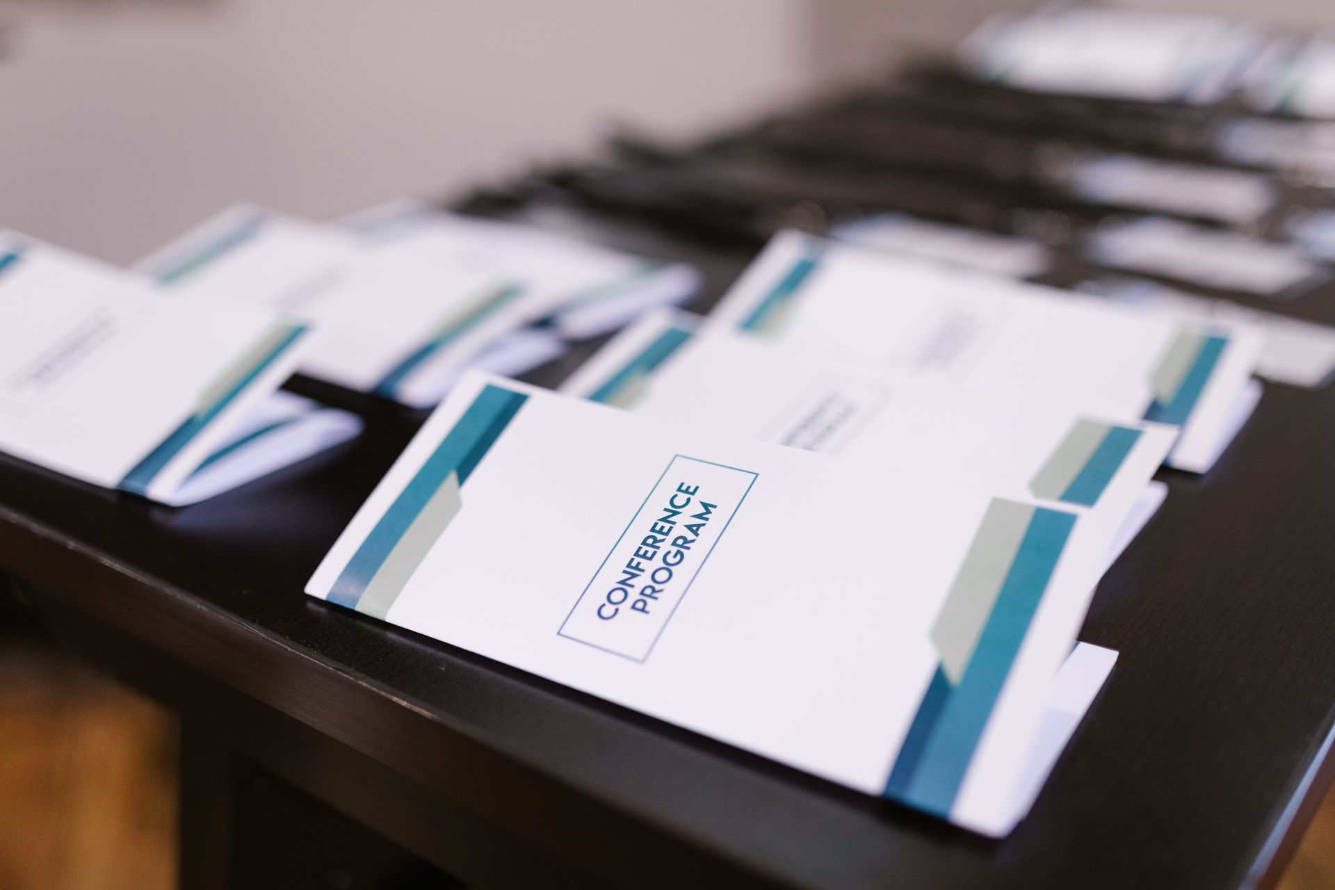 Several folders on a table with one that says corporate program