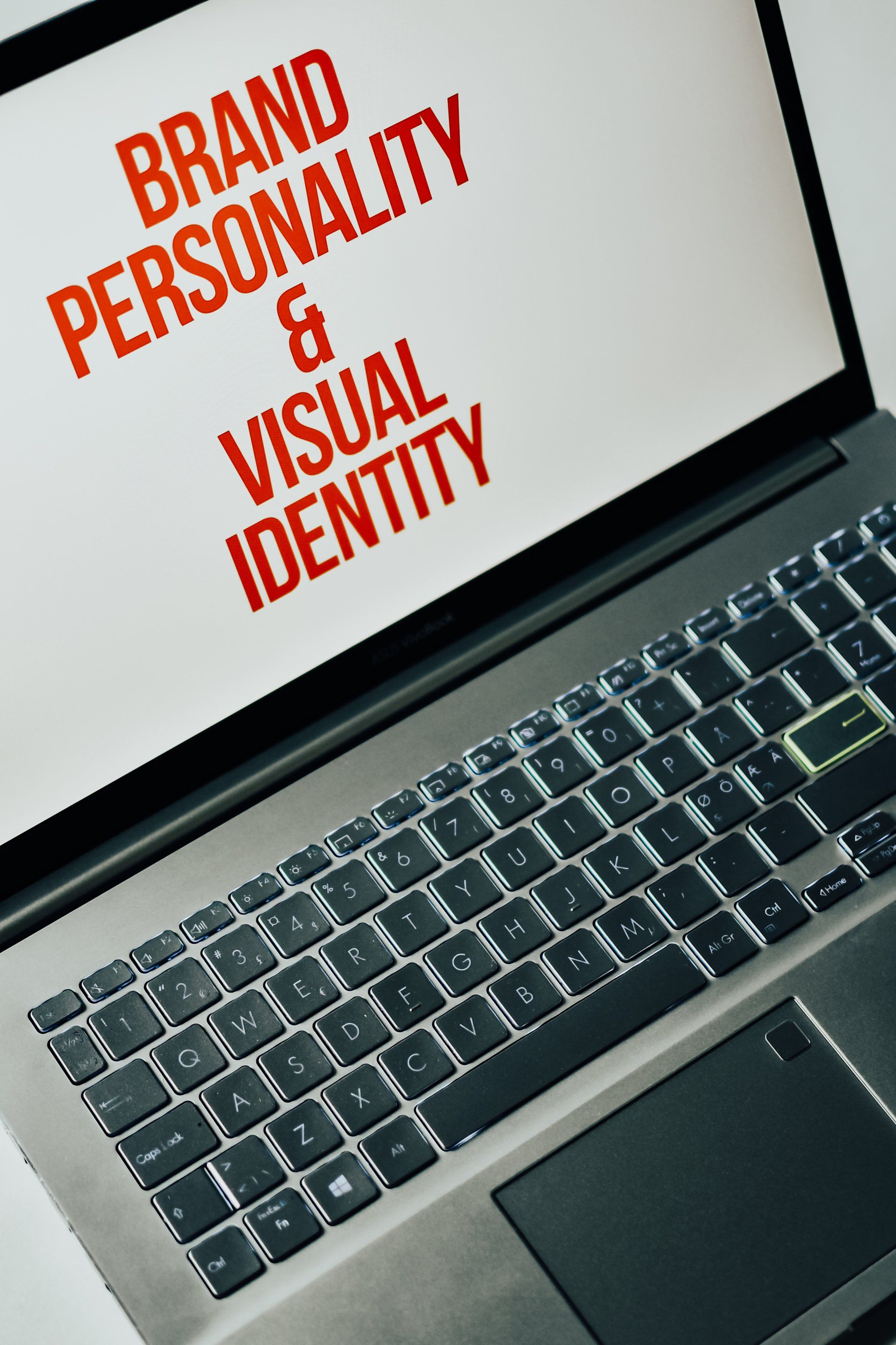 a laptop with a screen that says brand personality and visual identity