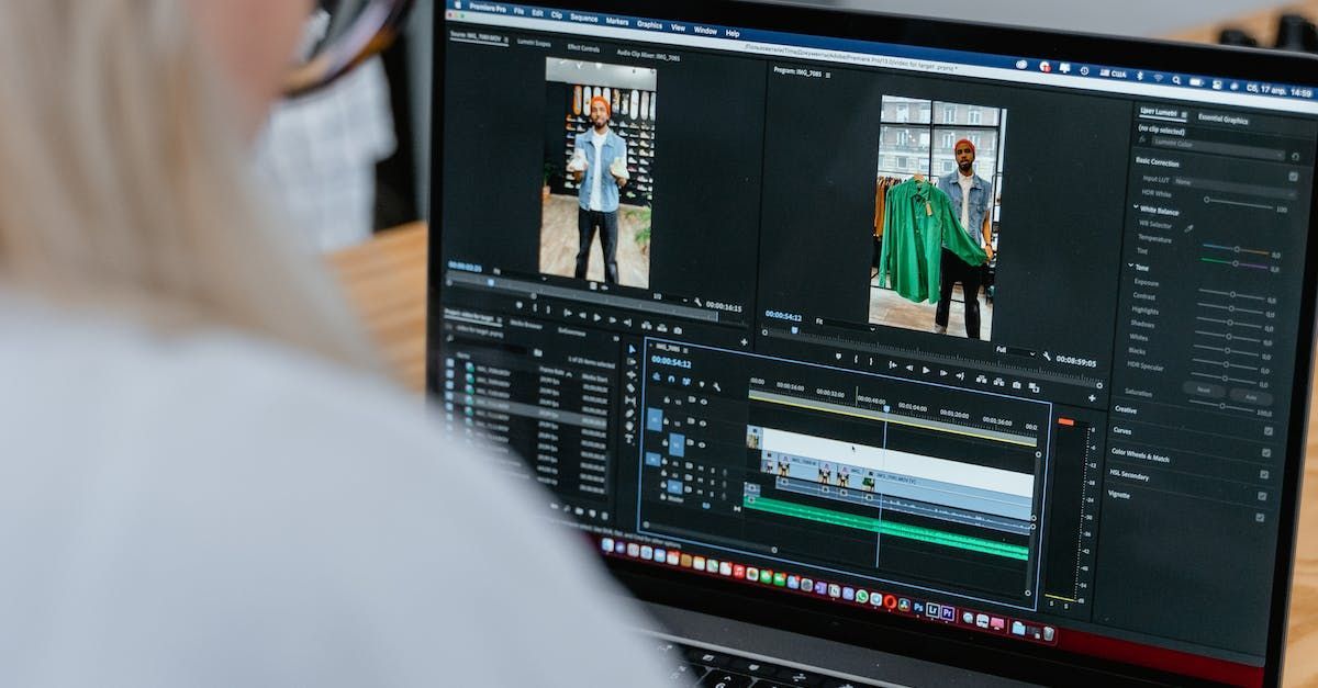 A woman is editing a video on a laptop computer.