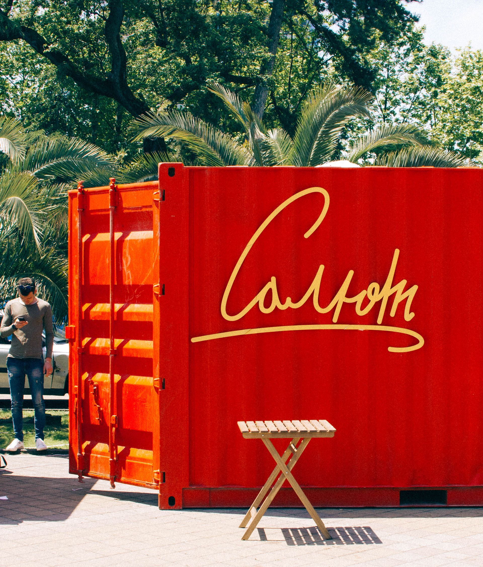 Red shipping container with gold script 