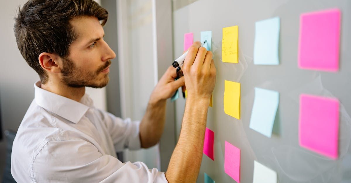 An elderly woman in a wheelchair is being helped by a nurse.