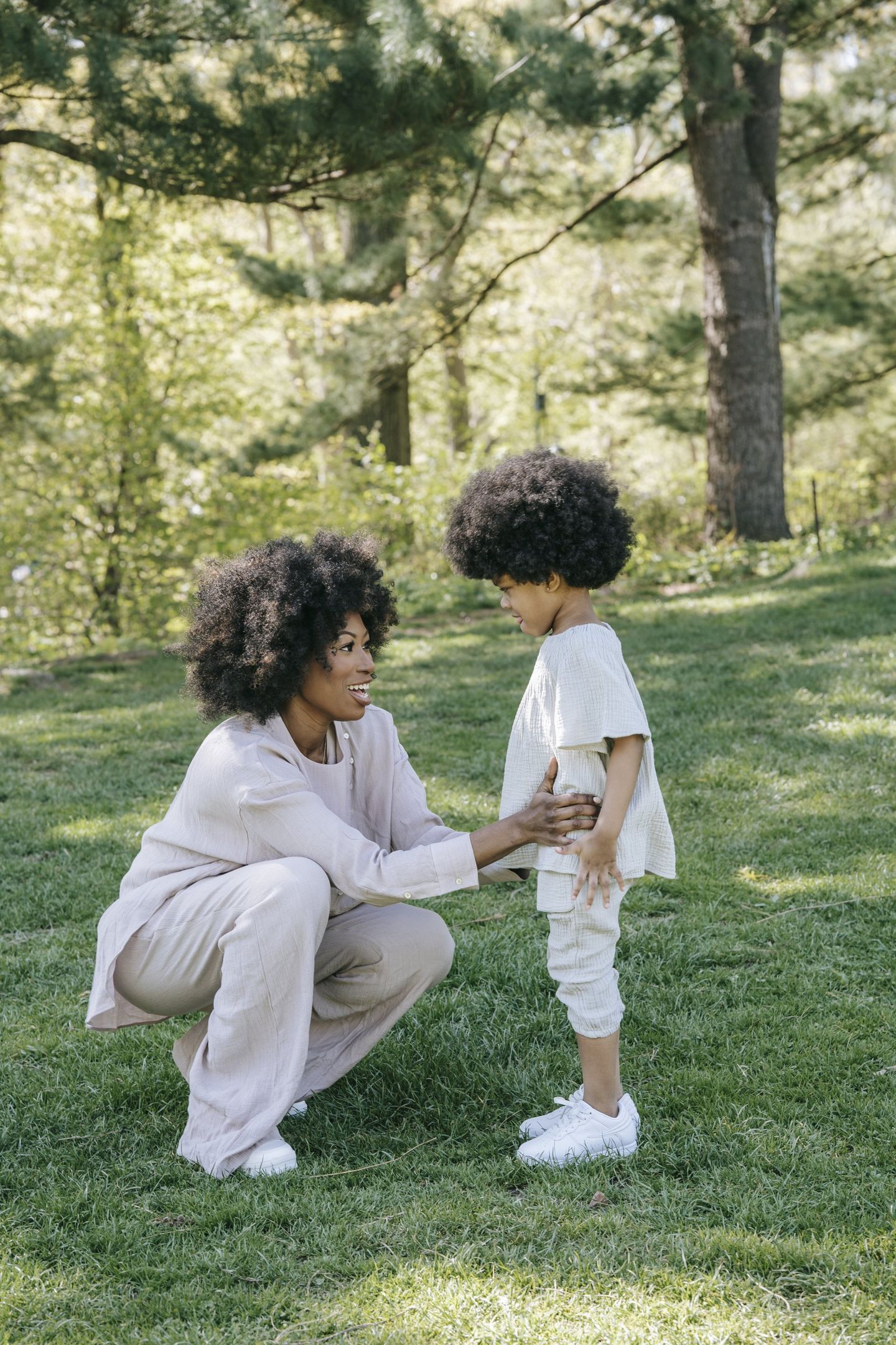 Mother smiling and speaking to son