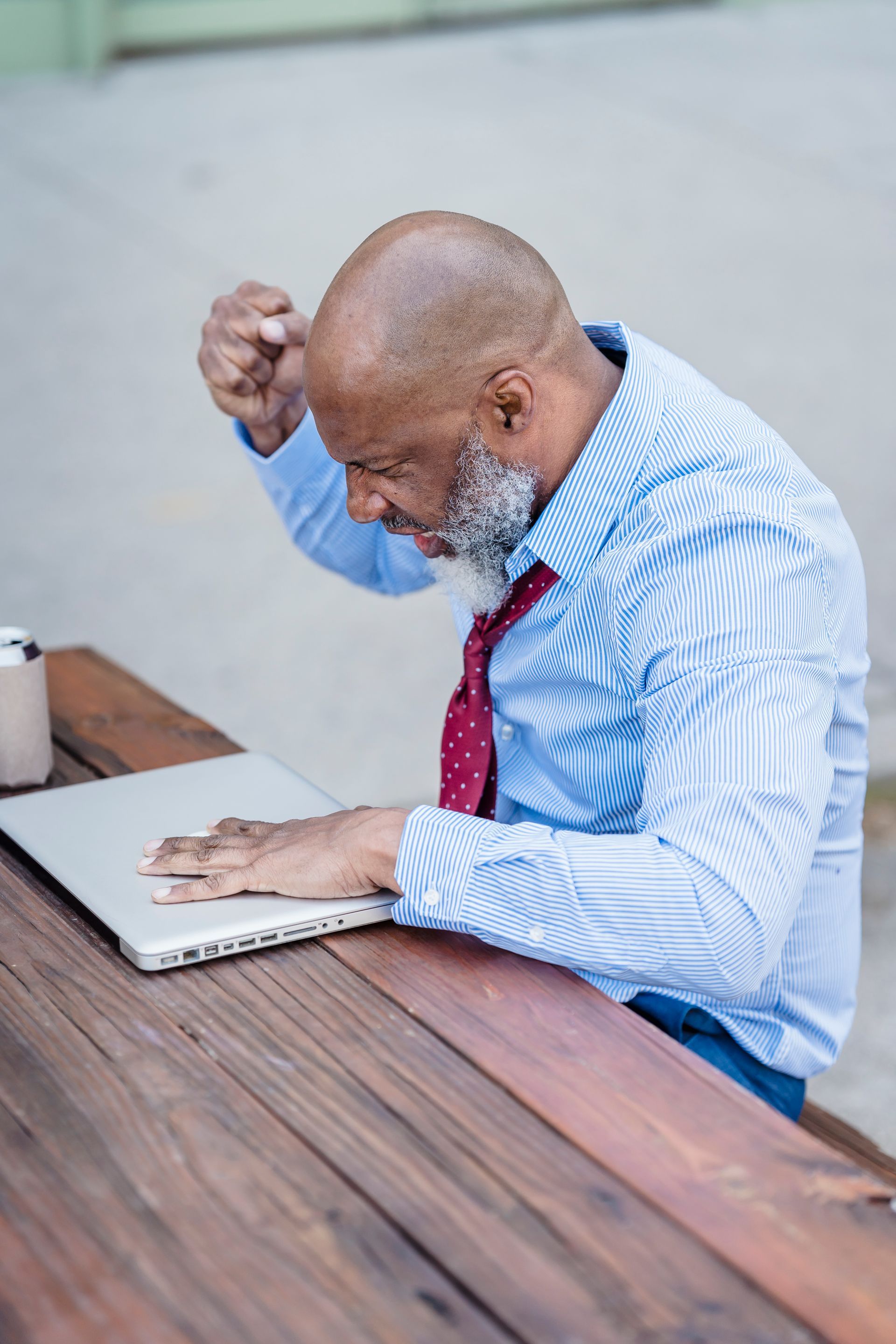 An upset man with laptop