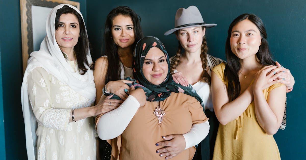 A group of women are posing for a picture together.