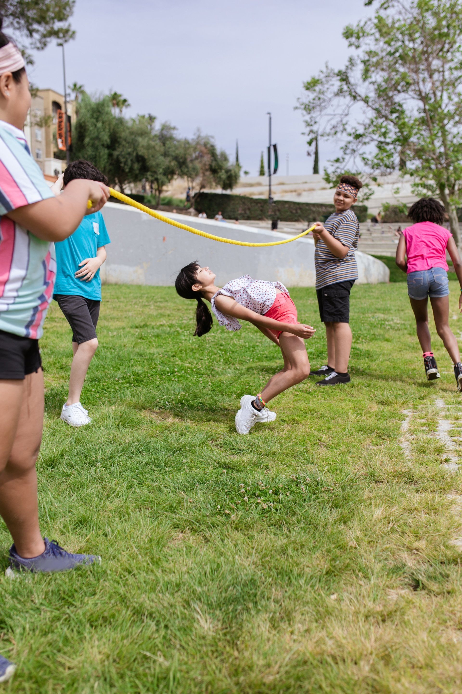 A group of children are playing a game in a park.