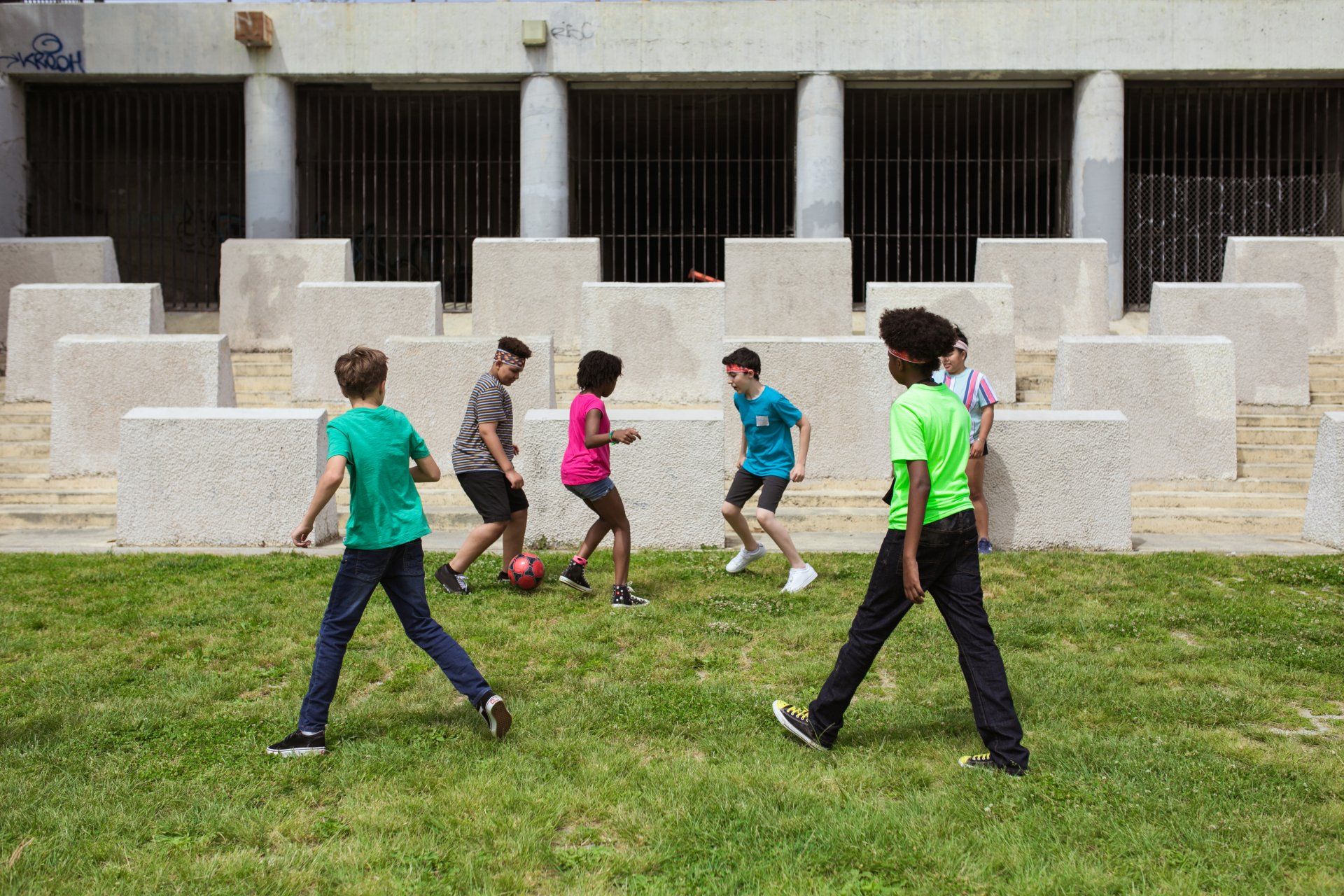 A group of kids playing soccer
