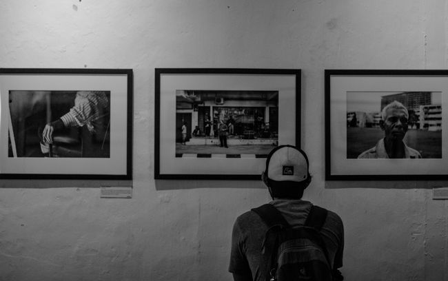 black and white image of a man in examining expressive photography