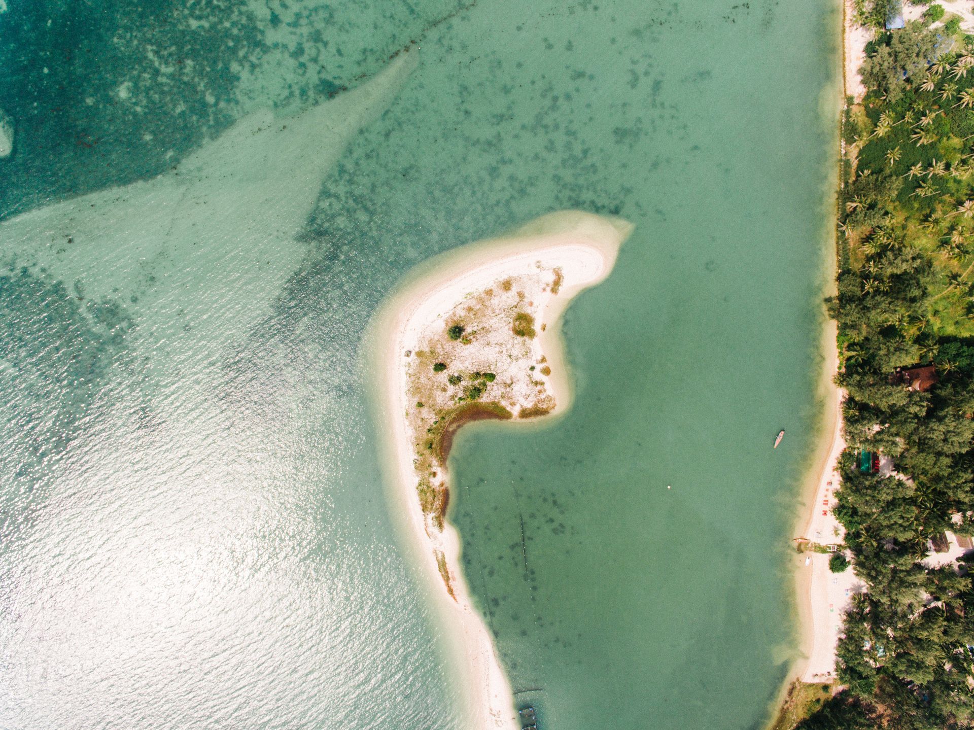 An aerial view of a small island in the middle of a body of water