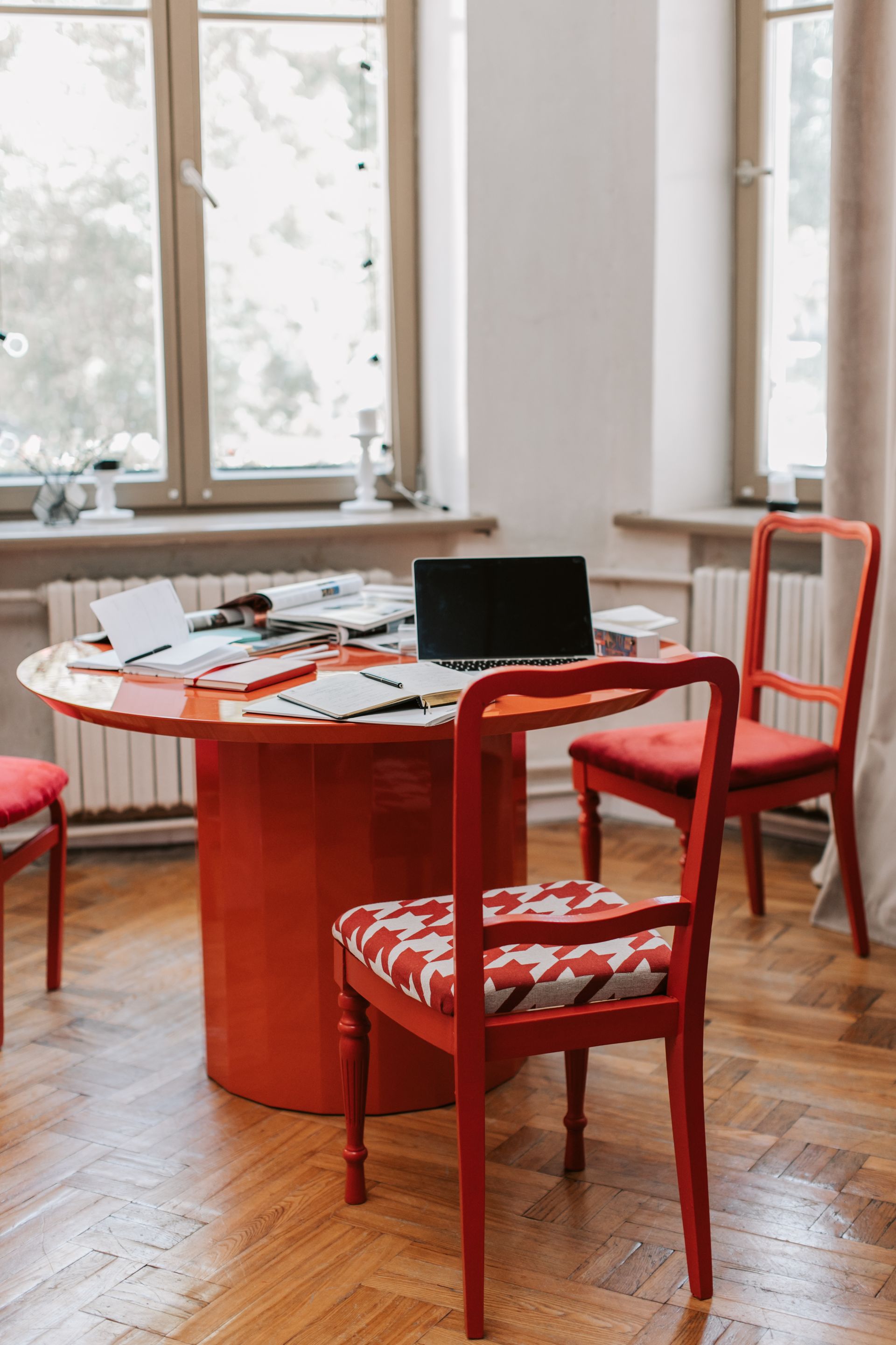 red desk with laptop