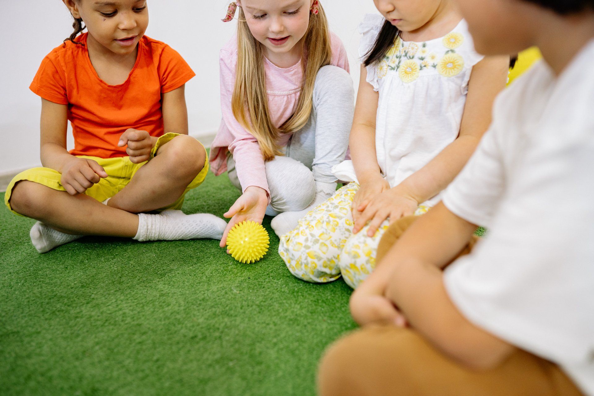 group of children sharing an inclusive ball game