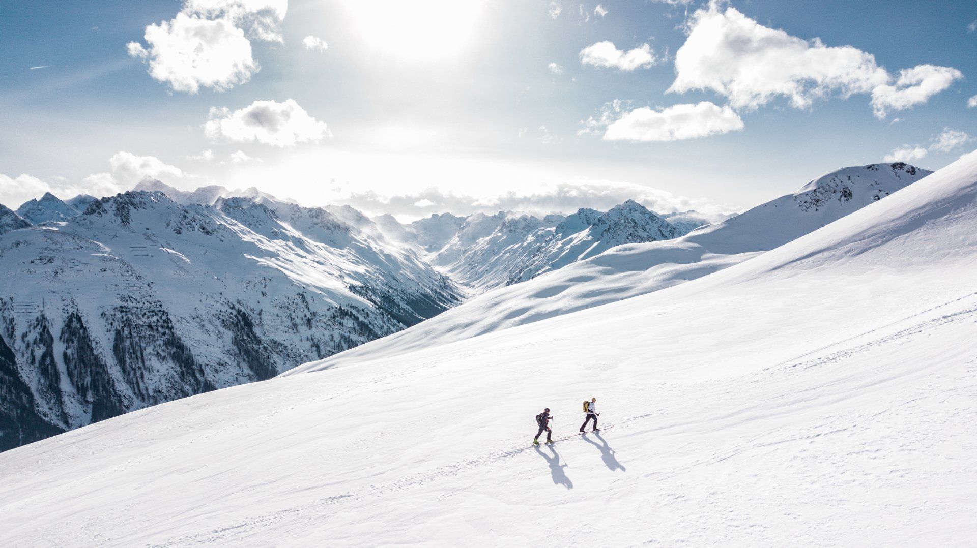 Two people alpine touring in the mountains