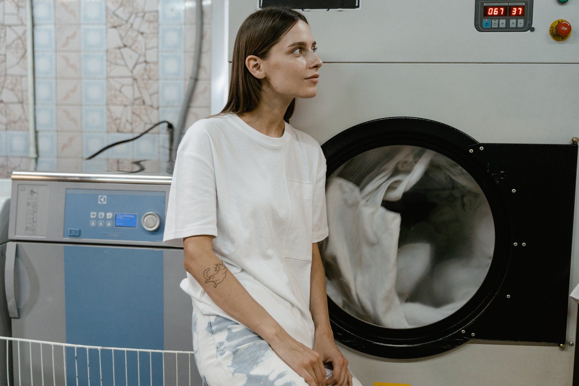a woman beside a dryer