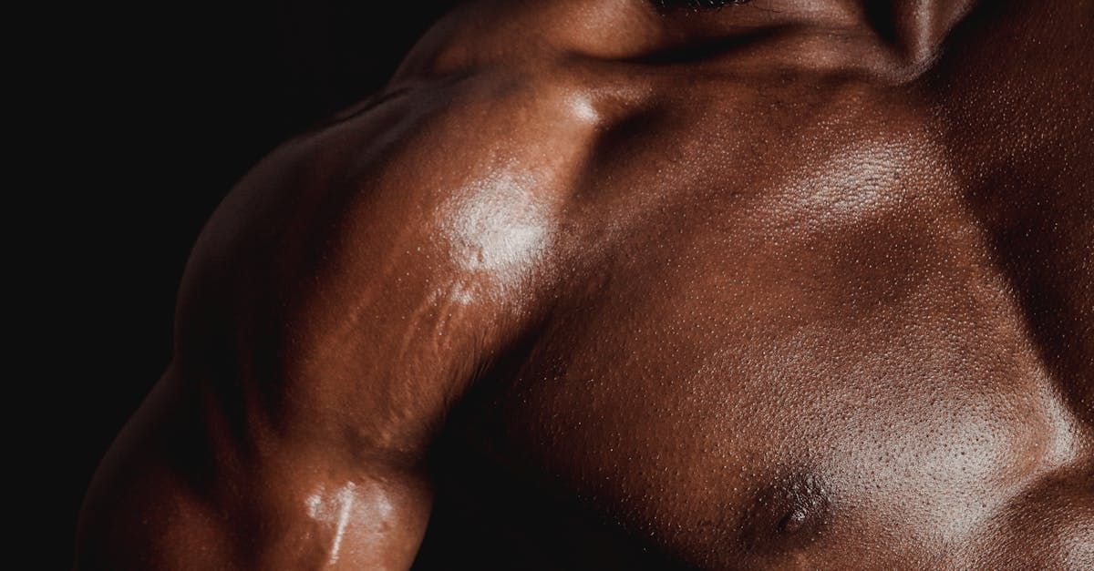 Close-up of a transgender man's chest after pectoral implant surgery, demonstrating natural-looking definition and improved chest shape.