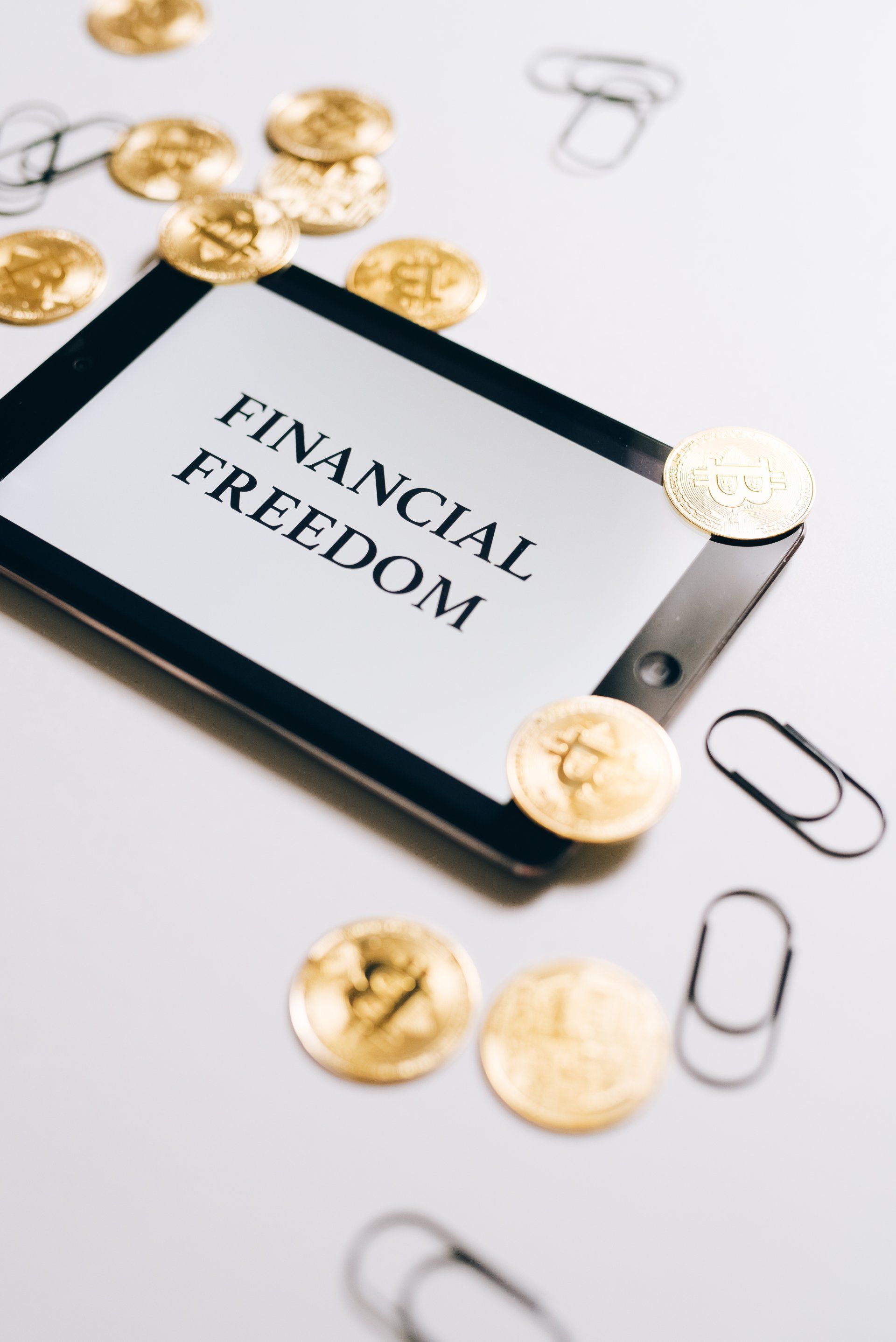 a tablet with the word financial freedom on it