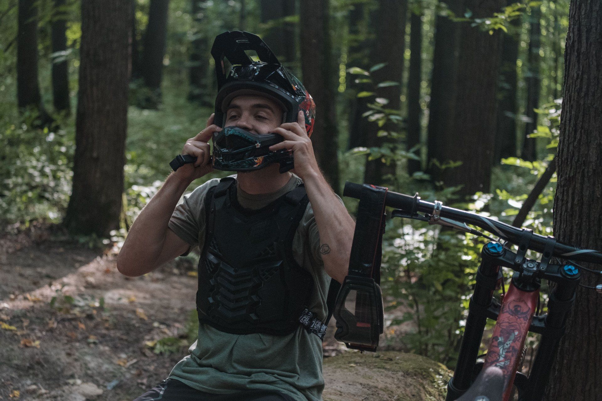 man wearing a type of mountain bike helmet called a full faced enduro