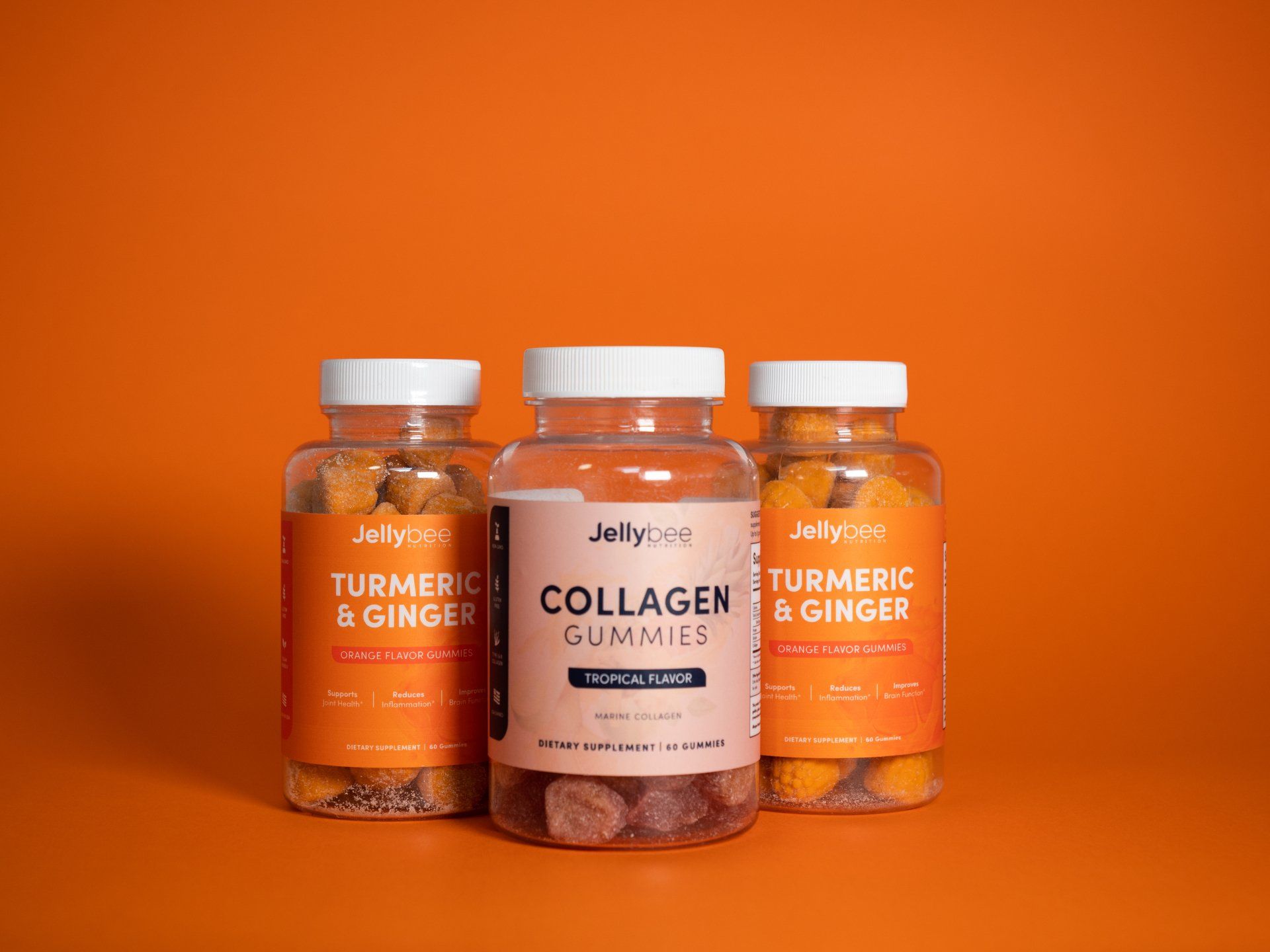 Three bottles of collagen gummies are sitting next to each other on an orange background.