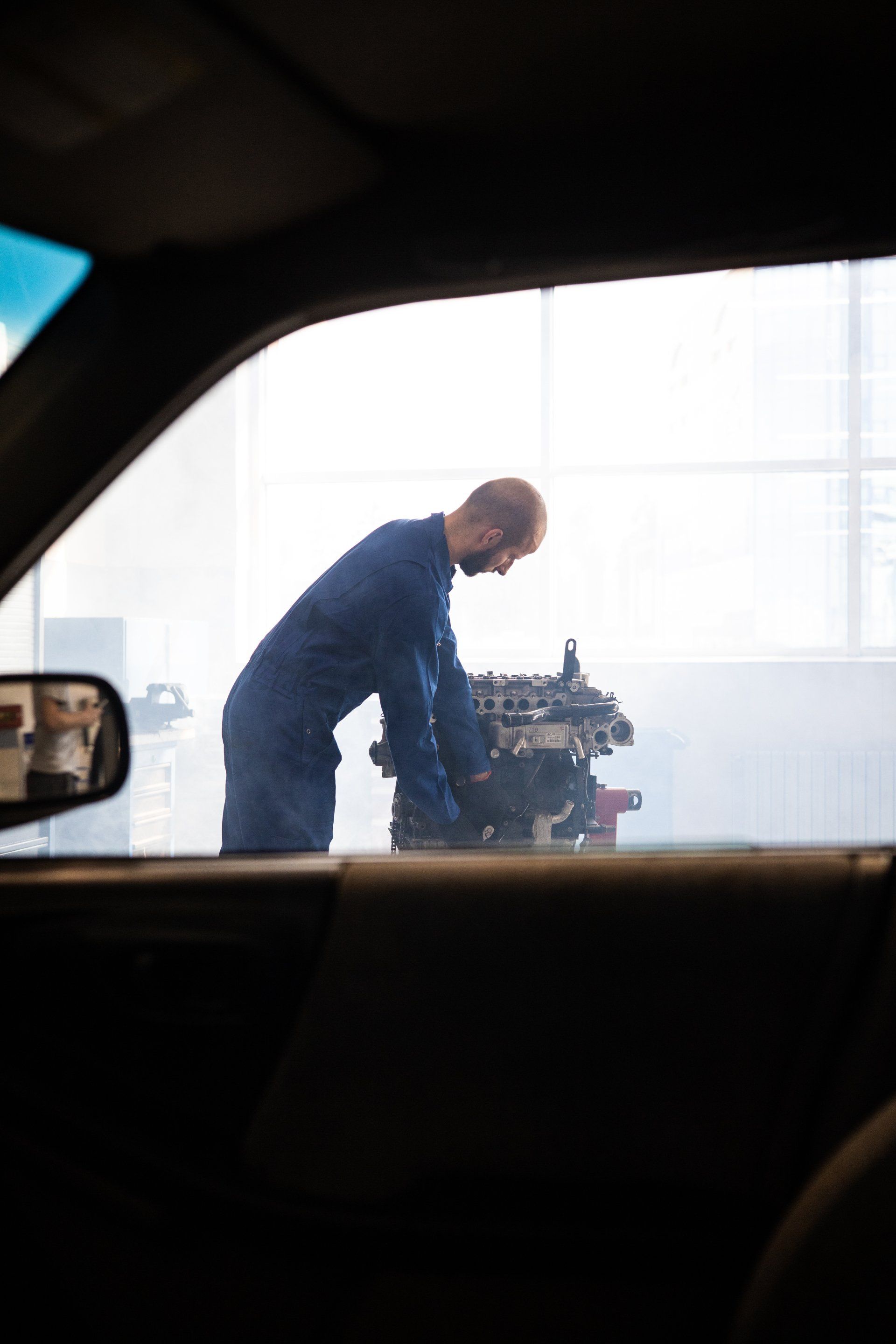 Mechanic working on engine repair services | Brighton Auto Service