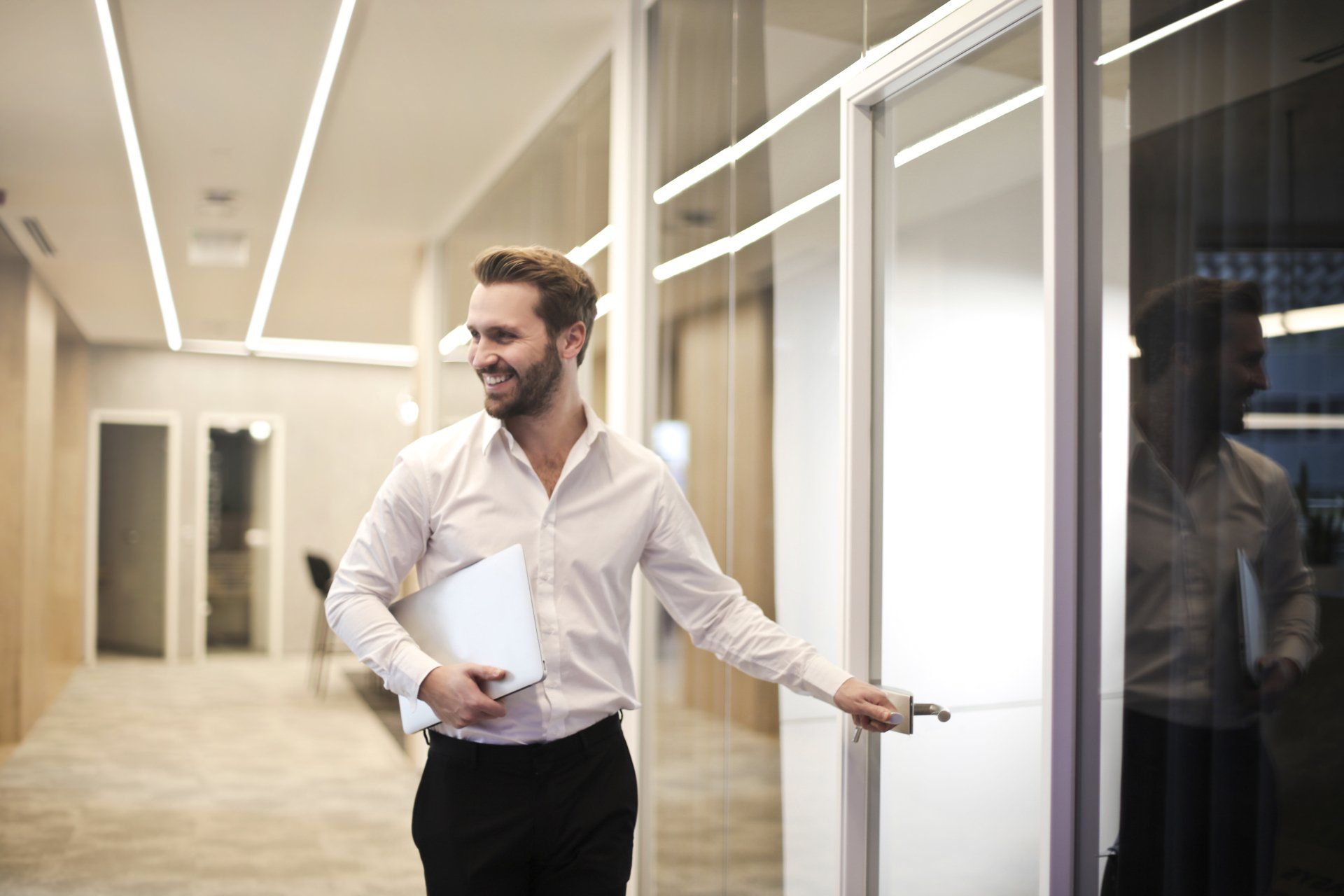 man walking into business room