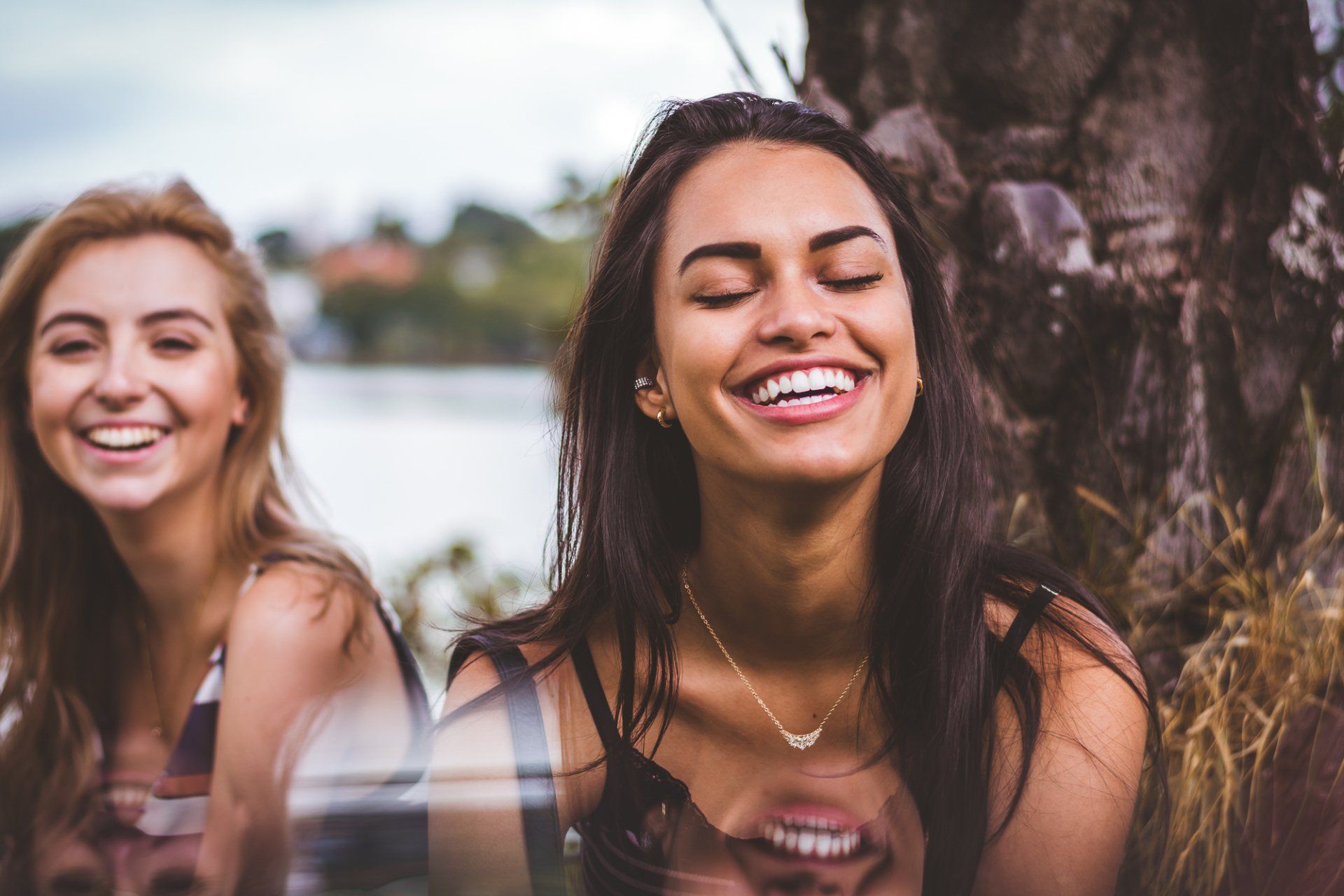 woman smiling with friends | Dentist in Metairie LA 70002
