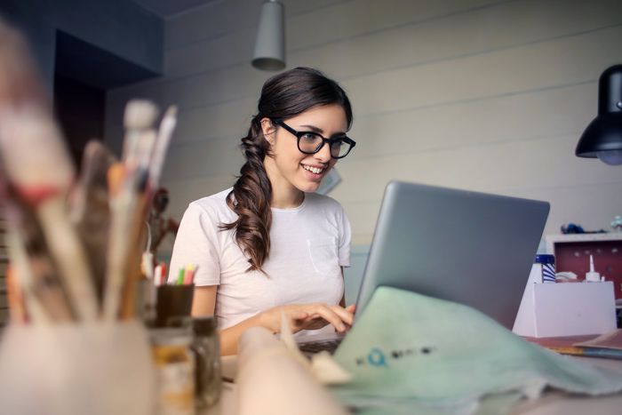 Young girl working on laptop