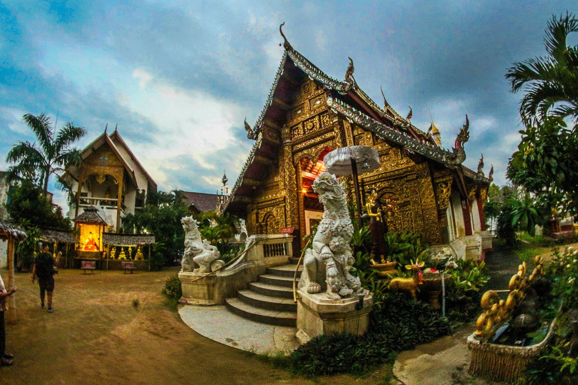 A large building with a lot of statues in front of it.