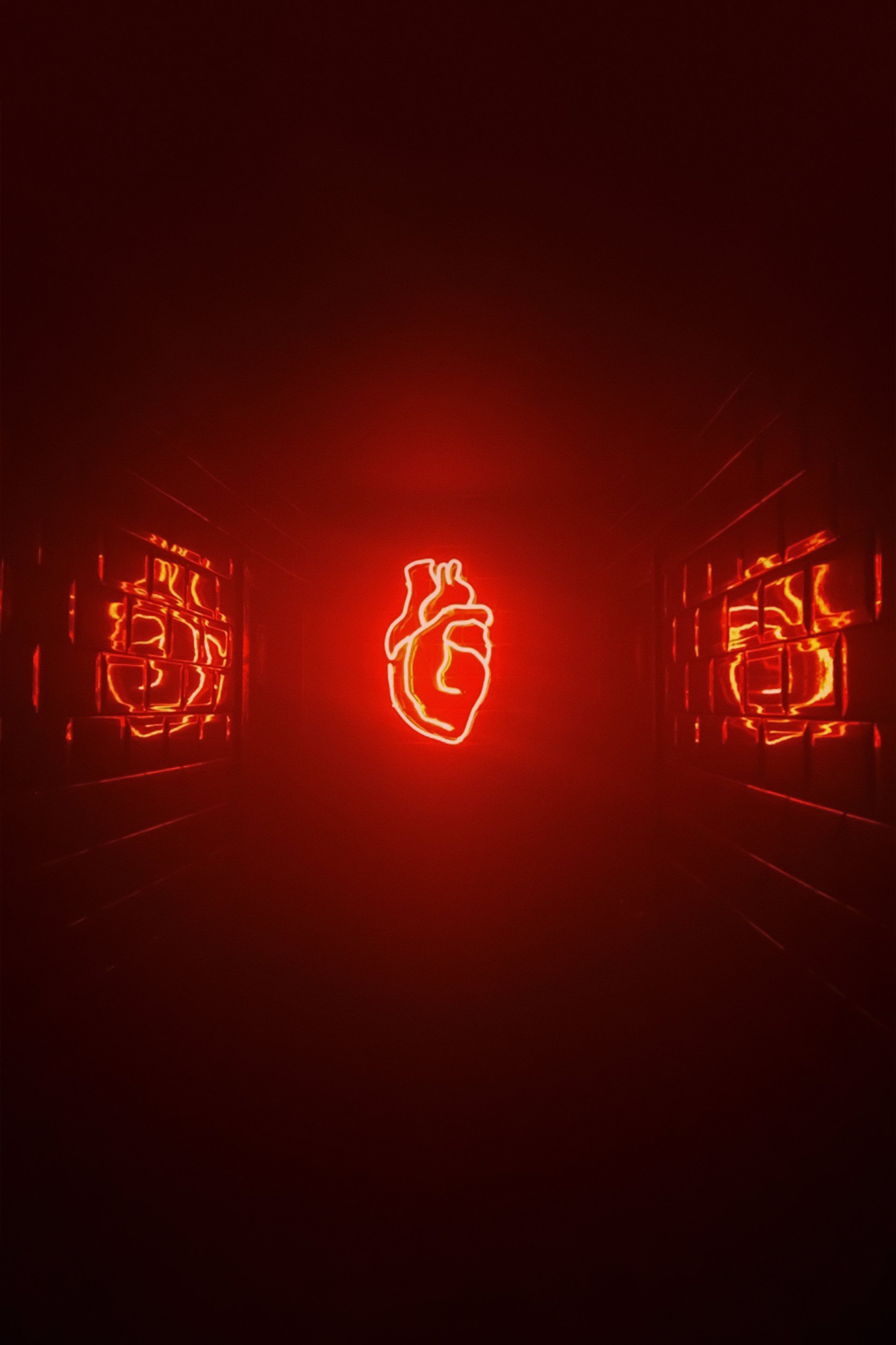 A neon heart is glowing in the dark in a dark room.