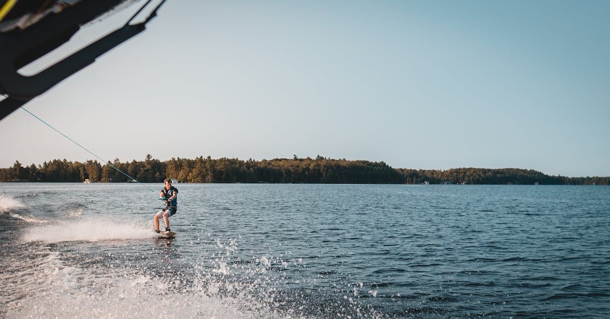 man-wakeboarding-on-the-lake