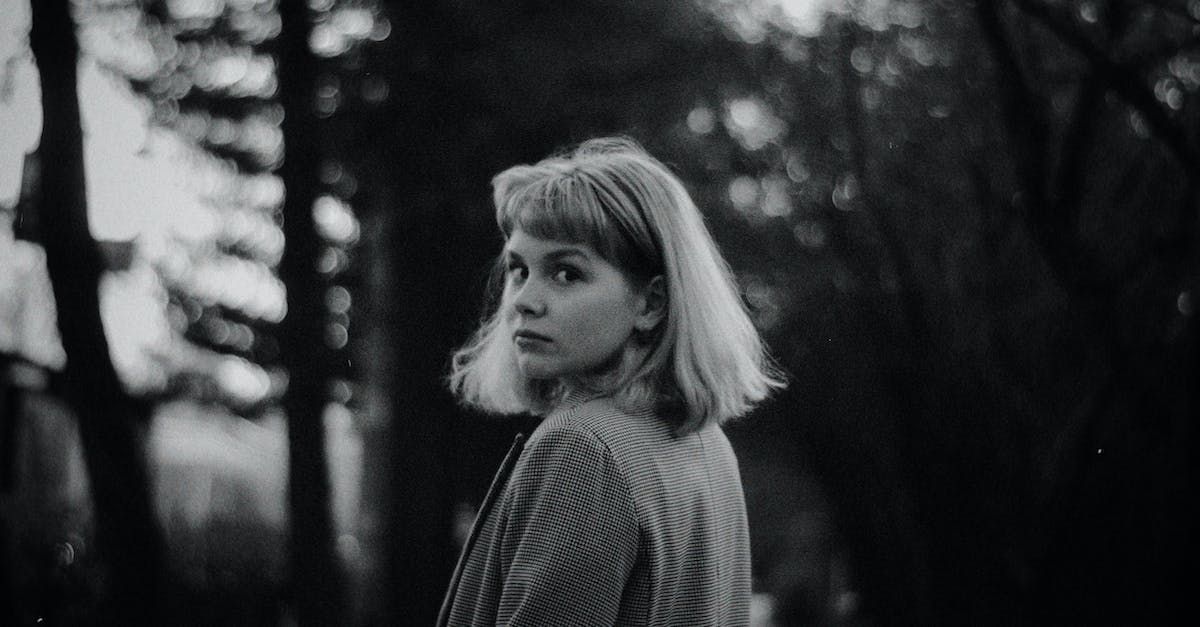 A black and white photo of a woman with a timeless bob.