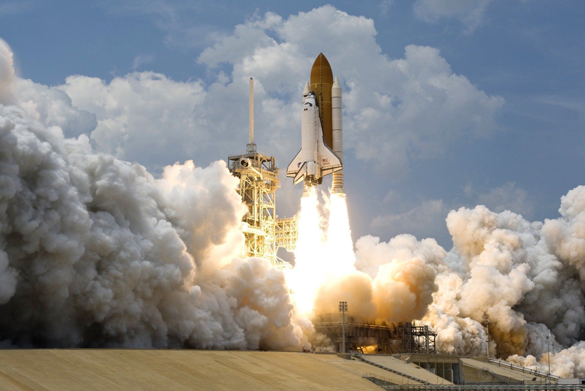 US Space Shuttle lifting off from launch site