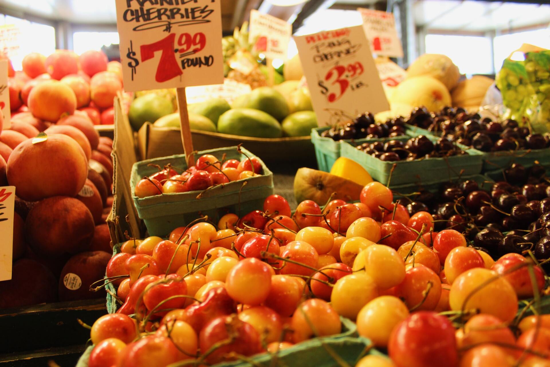 A bunch of cherries are for sale at a market
